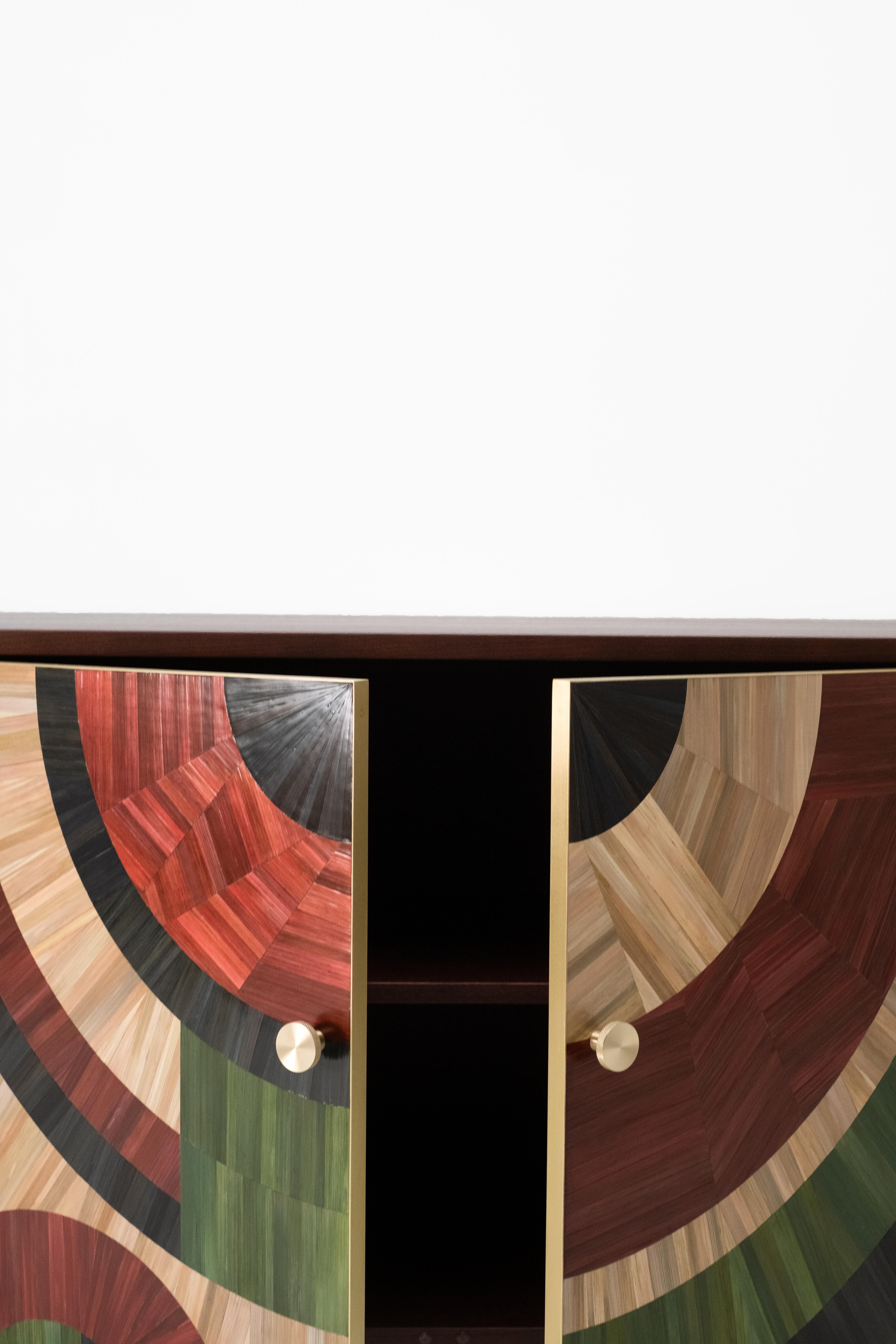 Solomia straw Marquetry Art Deco oakwood cabinet green red black natural by RUDA Studio

The cabinet Solomia is inspired by the fertility of our land. The ornament is made in the ancient straw Marquetry technique in red, green, black soil, and wheat