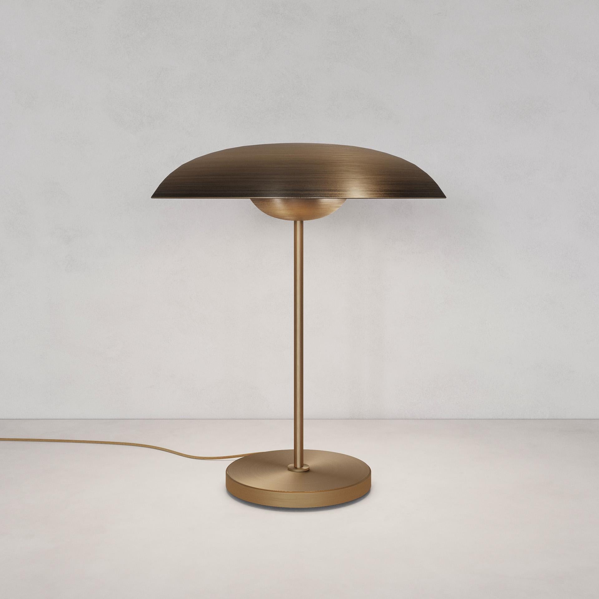 Solstice Ore Table Lamp by Atelier001
Dimensions: D40 x H47 cm
Materials: Shade Bronze gradient patinated brass
Framework Satin brass
Also Available: In different finishes.

All our lamps can be wired according to each country. If sold to the USA it
