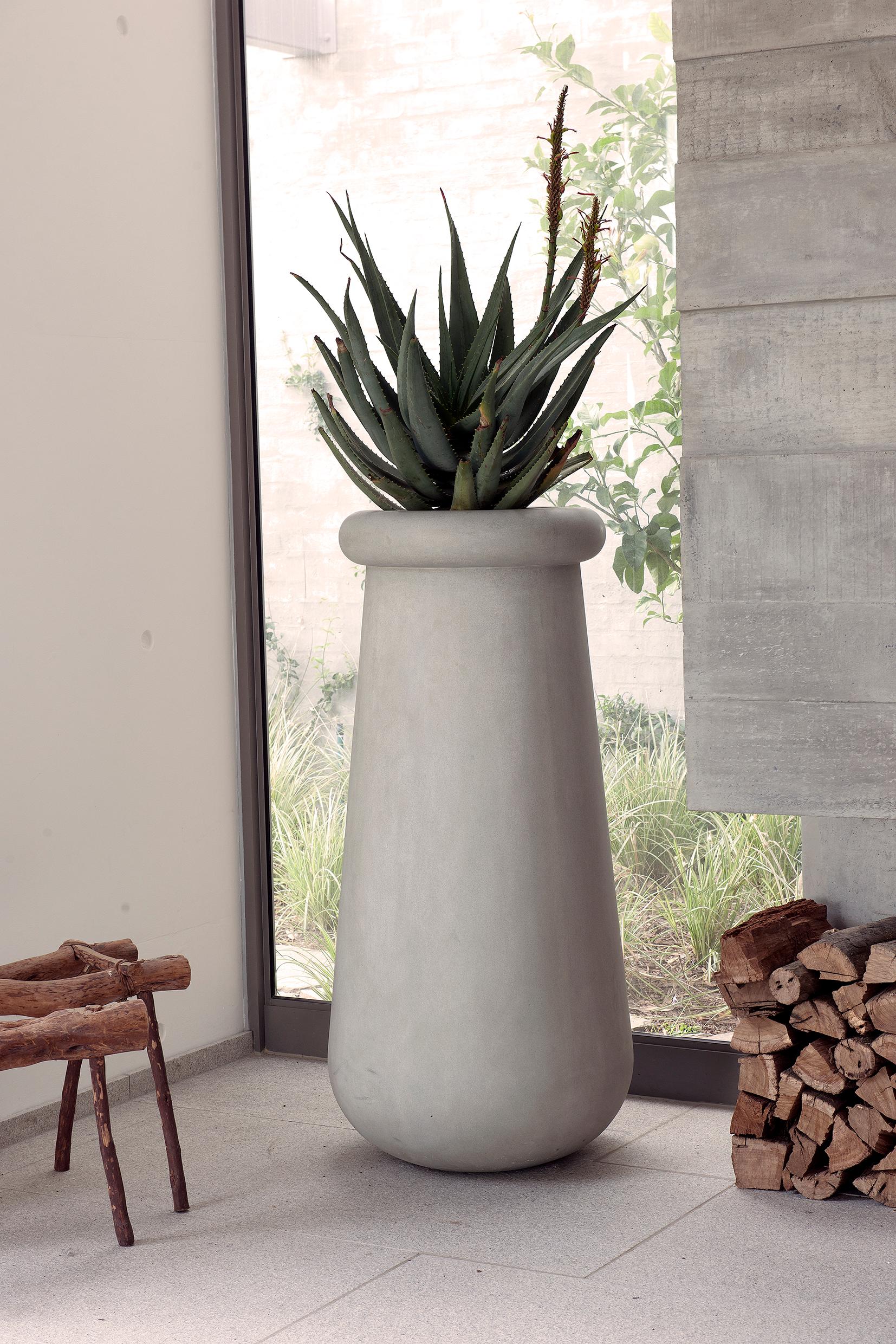 Soma Tall White Stone Planter by Indigenus
Designed by Laurie Wiid van Heerden
Dimensions: Ø 79,2 x H 130 cm.
Materials: Stone.
Weight: 120 kg.

Available in natural/oiled wood or stone. Different colors and sizes are available. Please contact