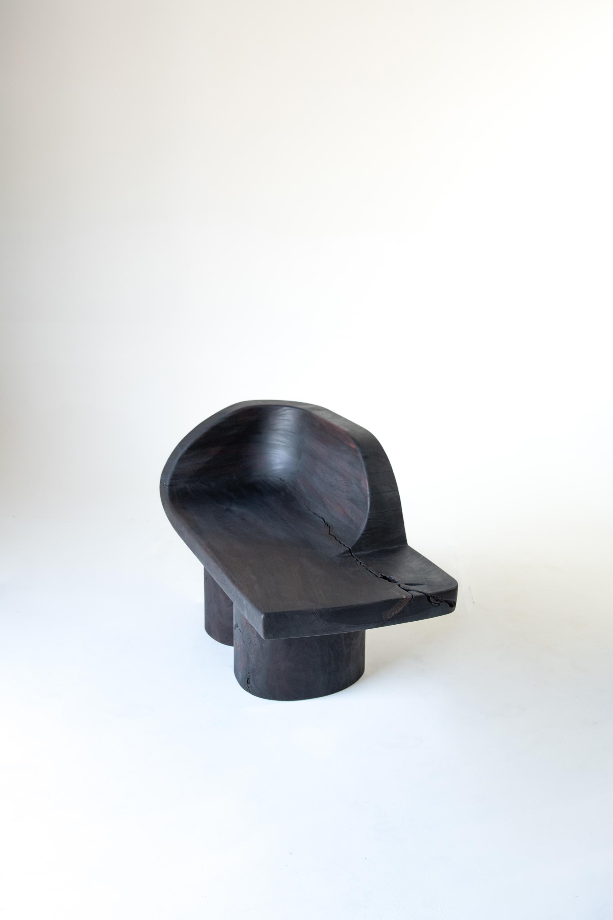 Reynold Rodriguez
Sometimes an Elephant/ Chaise, 2020
Charred hand-carved mahogany and almendro wood
28 x 42 x 21 in
Seat height 17.5 in
Edition of 8

Made of charred wood salvaged from trees that fell during the devastation of Hurricane Maria in