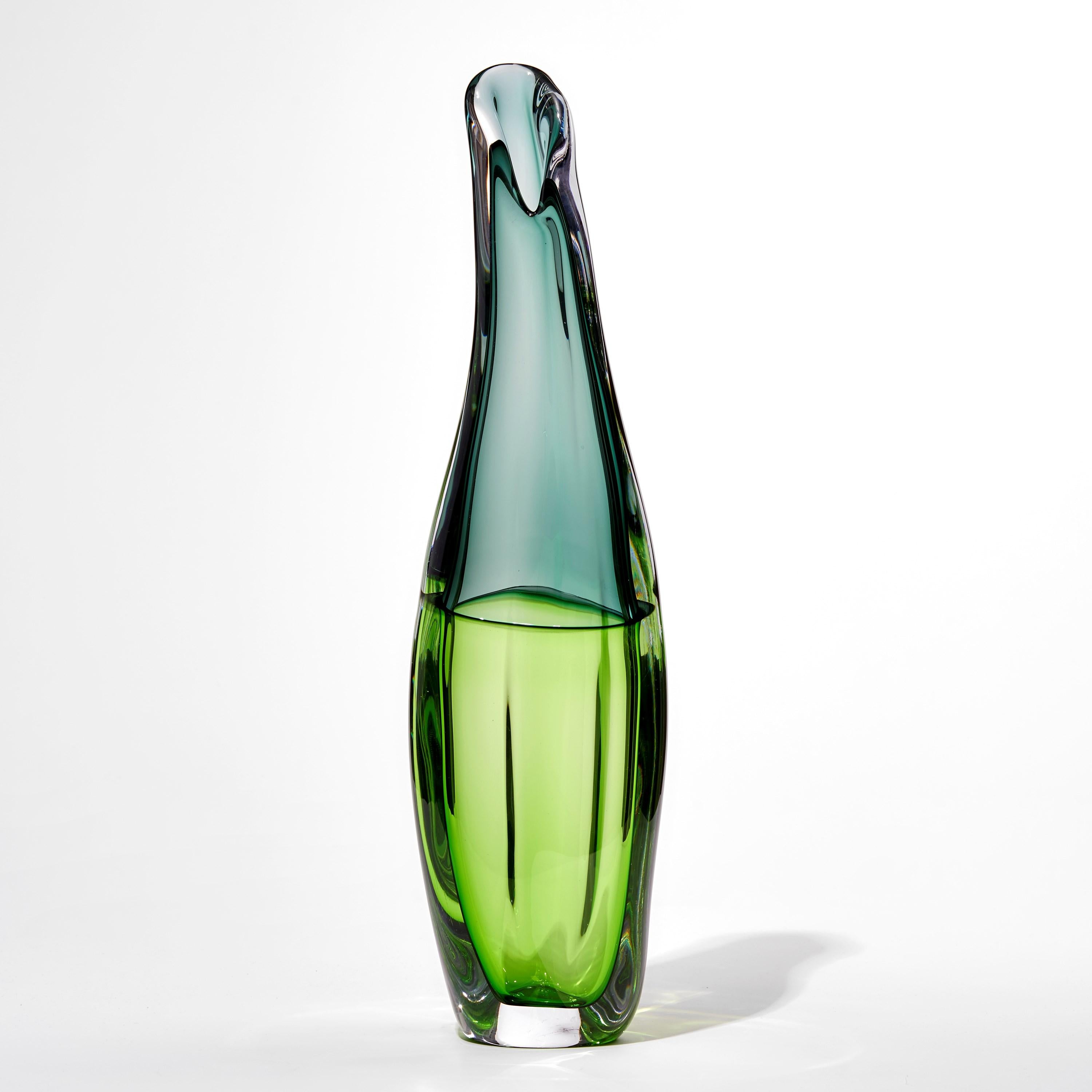 'Sommercalmo 132' is a unique hand blown sculptural vase by the British artist Vic Bamforth. Soft moss and verdant apple green meet and are encased in clear glass to create this stunning piece. With soft, twisting lines, the form has dynamic