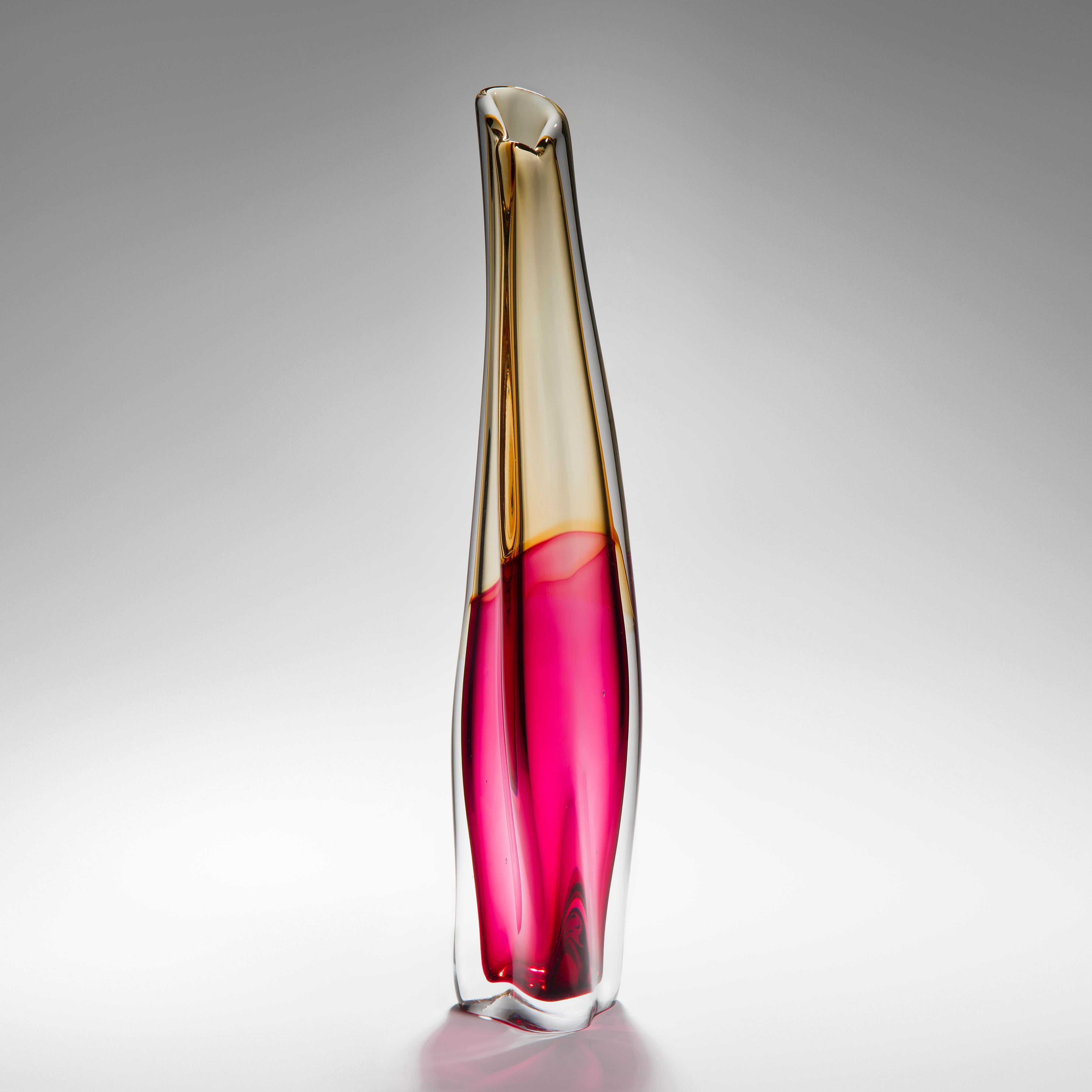 'Sommercalmo 142' is a unique hand blown sculptural vase by the British artist Vic Bamforth. Soft golden yellow and striking hot pink meet and are encased in clear glass to create this stunning piece. With soft, twisting lines, the form has dynamic
