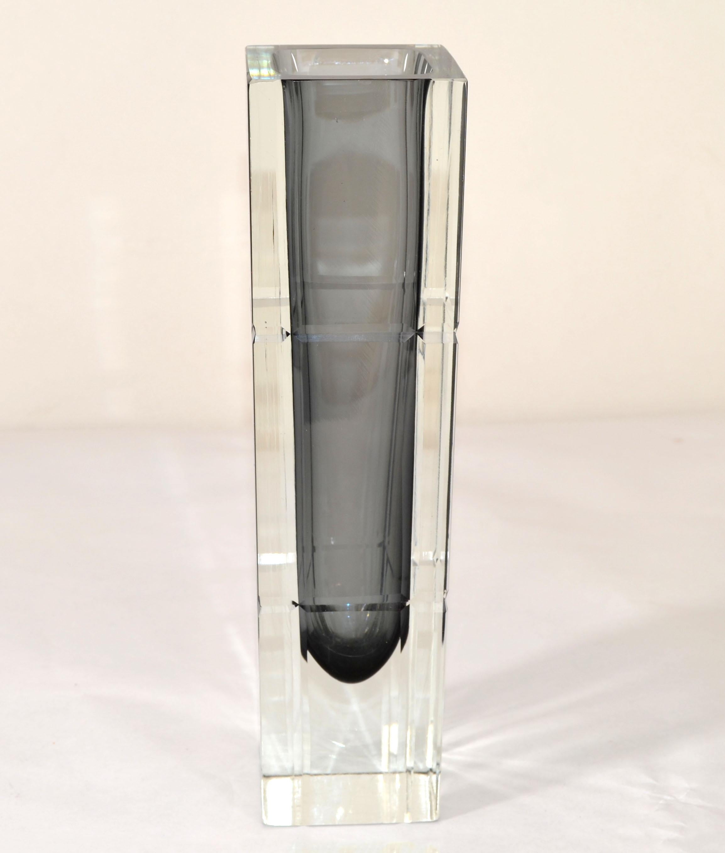 Stunning Cut Crystal Sommerso Murano Art Glass and blown Glass Vase in smoked and clear glass made by Alessandro Mandruzzato.
Looks amazing from any angle.
No markings.
Measures:
Length: 2.75 inches x 2.75 inches x 10 inches Height.

A-431-335