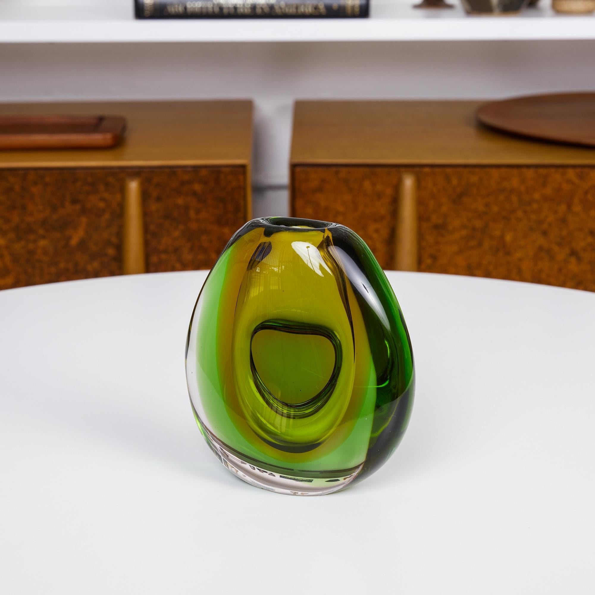 Sommerso Murano Glass Vase by Flavio Poli, Italy, circa 1960s. The teardrop shaped vase features a slim profile and is made of “Sommerso” (Italian for “submerged”) glass, a Murano glassmaking technique of creating two or more layers of contrasting