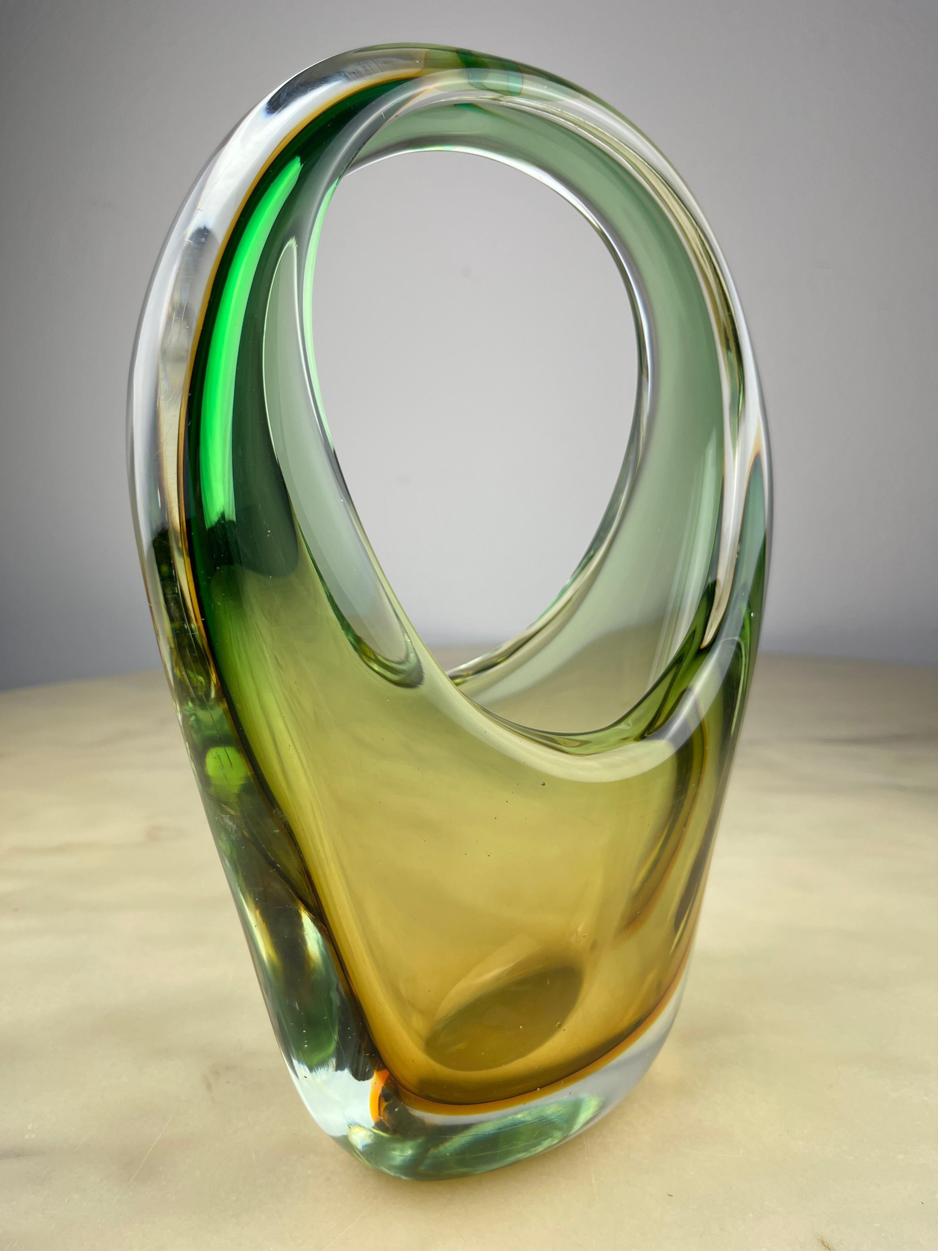 Sommerso glass vase from Murano, Italy, 1960s
Intact, small signs of aging.

Submerged glass is obtained by immersing the glass being processed in crucibles with different colors. The object is thus made up of several differently colored transparent