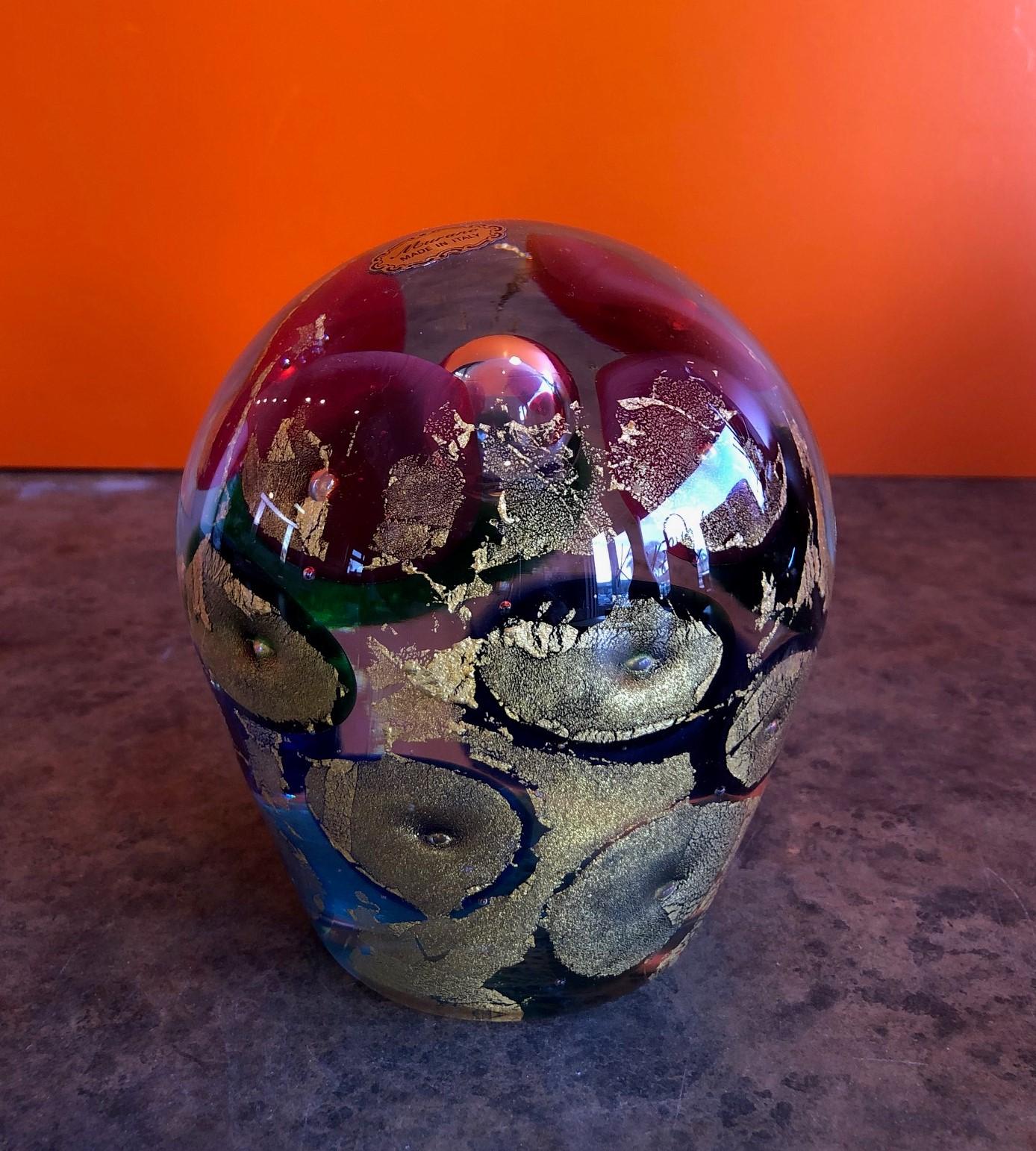 Vintage Sommerso orb sculpture / large paperweight by Murano Glass, circa 1970s. The outline of the sculpture is clear blown glass with an inner core of shimmering, sparkling gold circles. Truly a gorgeous piece; much more impressive in person than