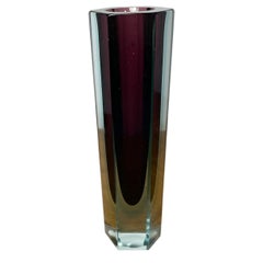 Sommerso vase made of faceted Murano glass in reddish violet