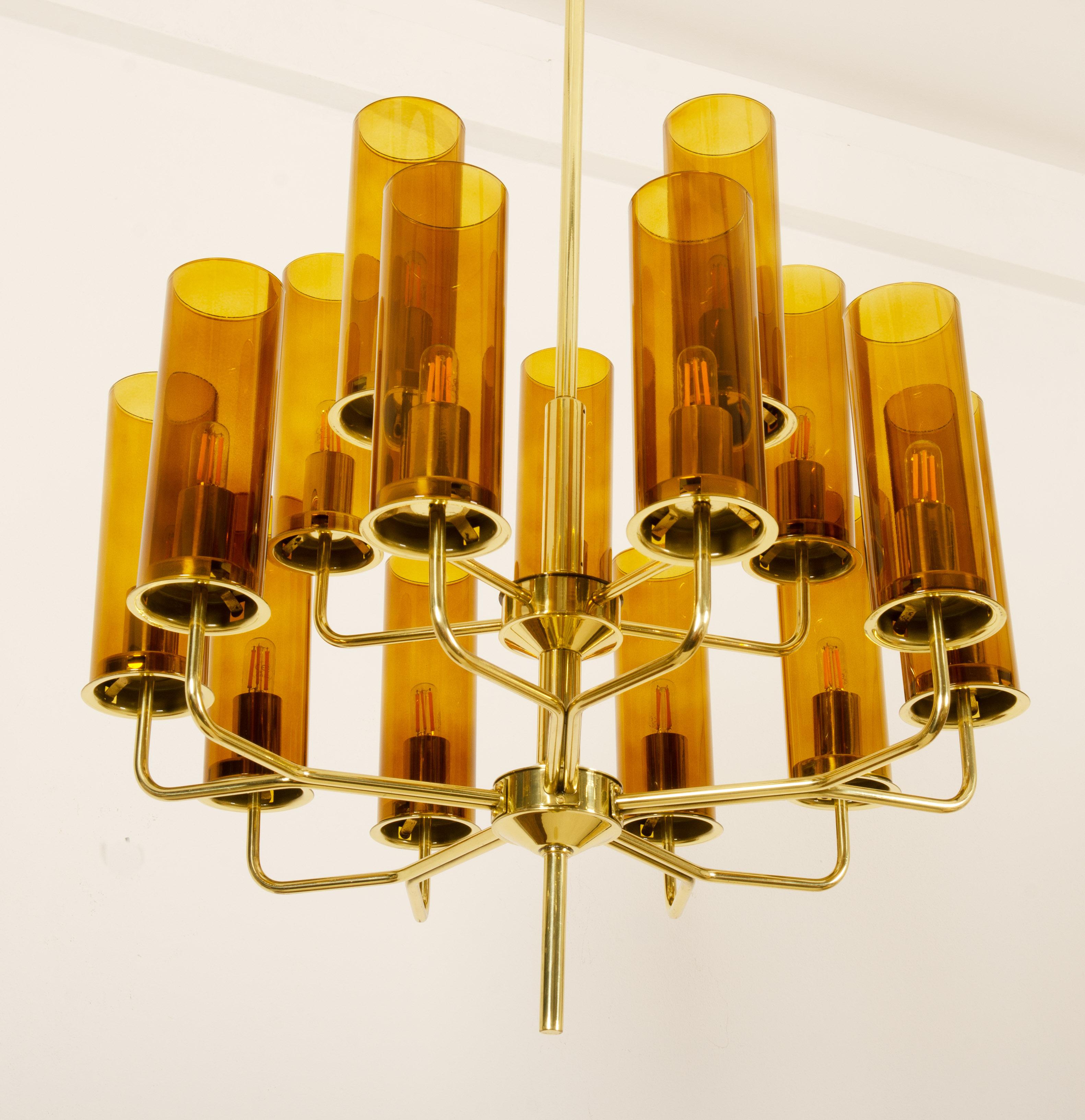 Brass frame with 15 arm fitted each with E14 sockets and glass shades. Model  T-434/15 Sonata, designed by Hans-Agne Jakobsson for AB Markaryd, Sweden, 1960s. Chandelier is fully restored and with new wiring. Up to 2 available, price per chandelier 