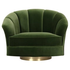Swivel Soneto armchair upholstered in forest green velvet by Bow and Arrow