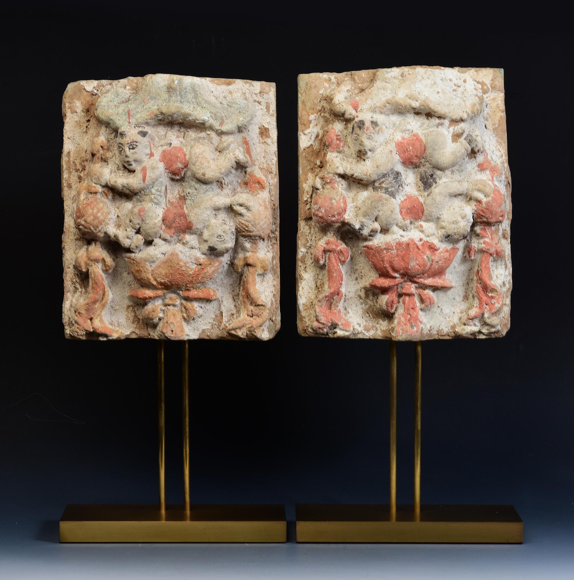 A pair of antique Chinese painted pottery panel with figures.

Age: China, Song Dynasty, 10th - 12th Century
Size of panels only: Height 26 - 26.7 C.M. / Width 19.7 - 20.5 C.M.
Height including stand: 44.6 - 45.5 C.M.
Condition: Well-preserved old