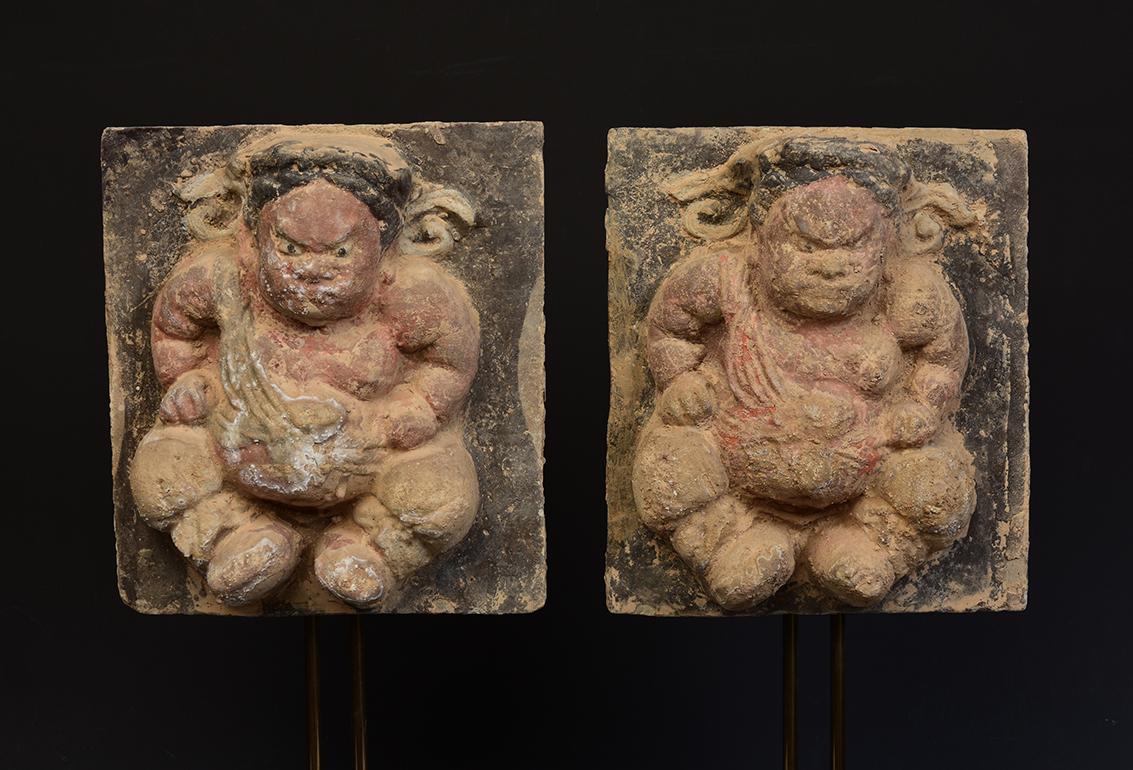 A pair of Chinese pottery brick tile with tomb guardian.

Age: China, Song Dynasty, 10th - 12th Century
Size: Height 19.8 C.M. / Width 16.9 - 17.7 C.M.
Size including Stand: 40 C.M.
Condition: Well-preserved old burial condition overall with