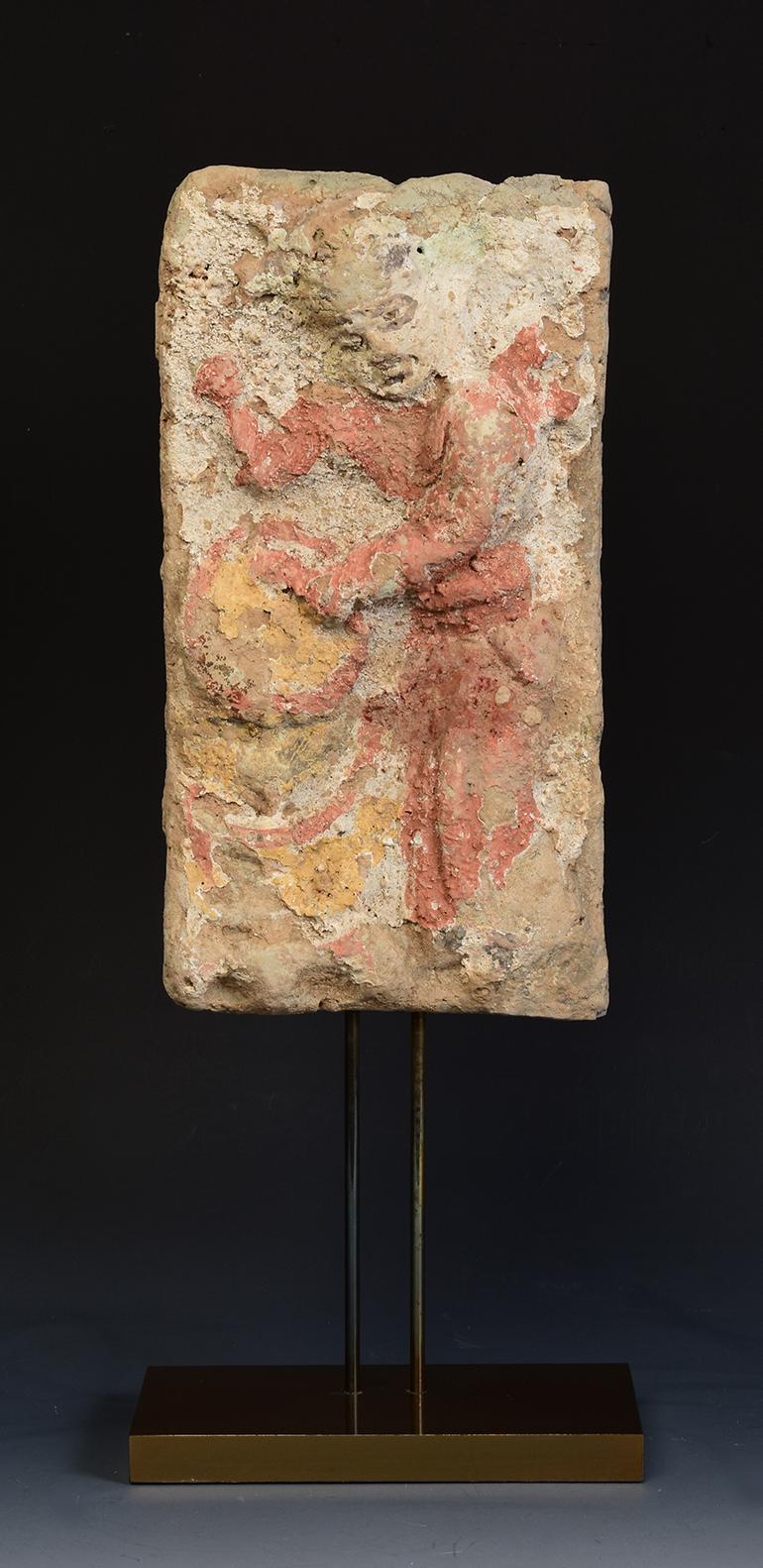 Antique Chinese painted pottery panel of musician drummer.

Age: China, Song Dynasty, 10th - 12th Century
Size of panel only: Height 27 C.M. / Width 14.1 C.M.
Height including stand: 40.8 C.M.
Condition: Well-preserved old burial condition overall
