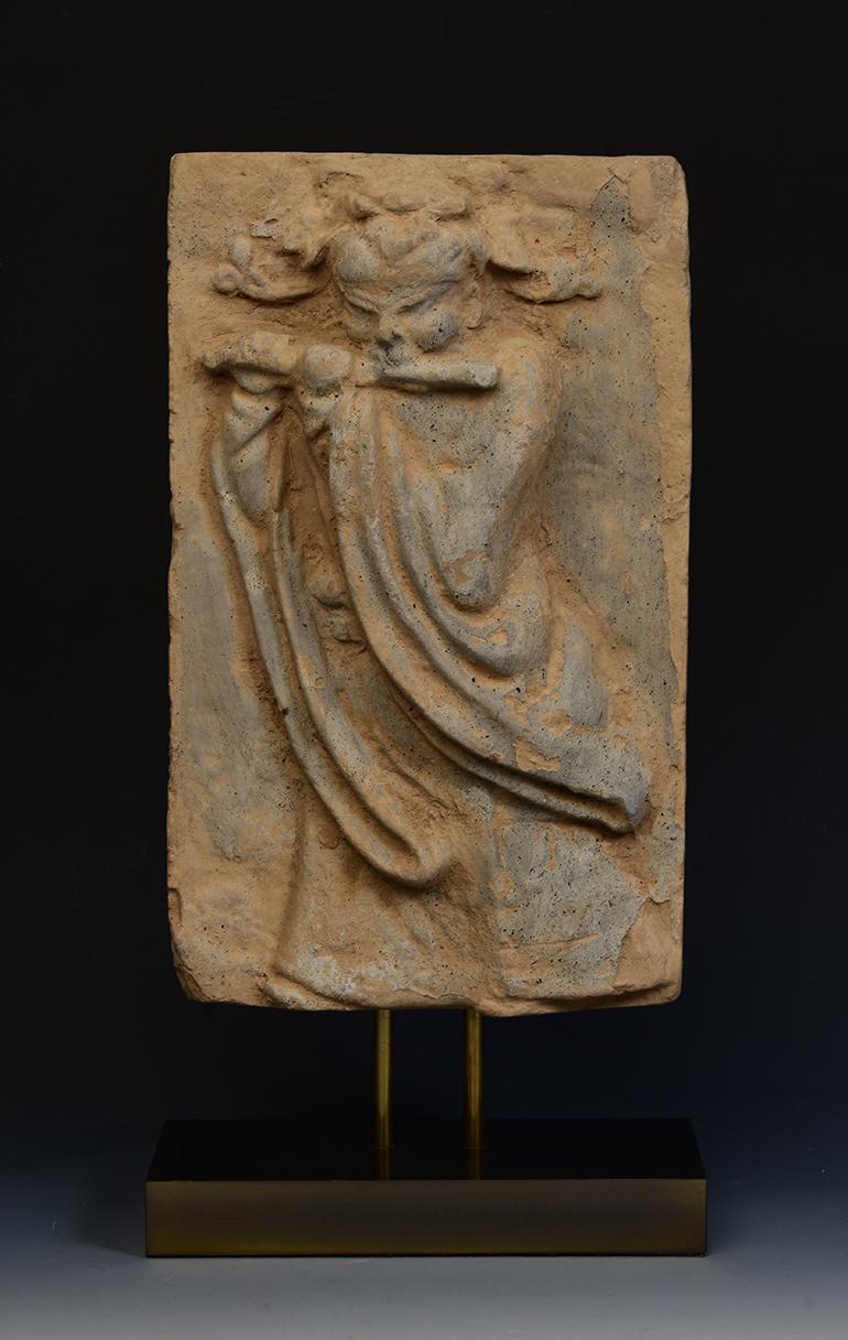 Antique Chinese pottery brick tile with musician flute player.

Age: China, Song Dynasty, 10th - 12th Century
Size excluding stand: Height 31.6 C.M. / Width 18.8 C.M.
Height including stand: 39.8 C.M.
Condition: Well-preserved old burial condition