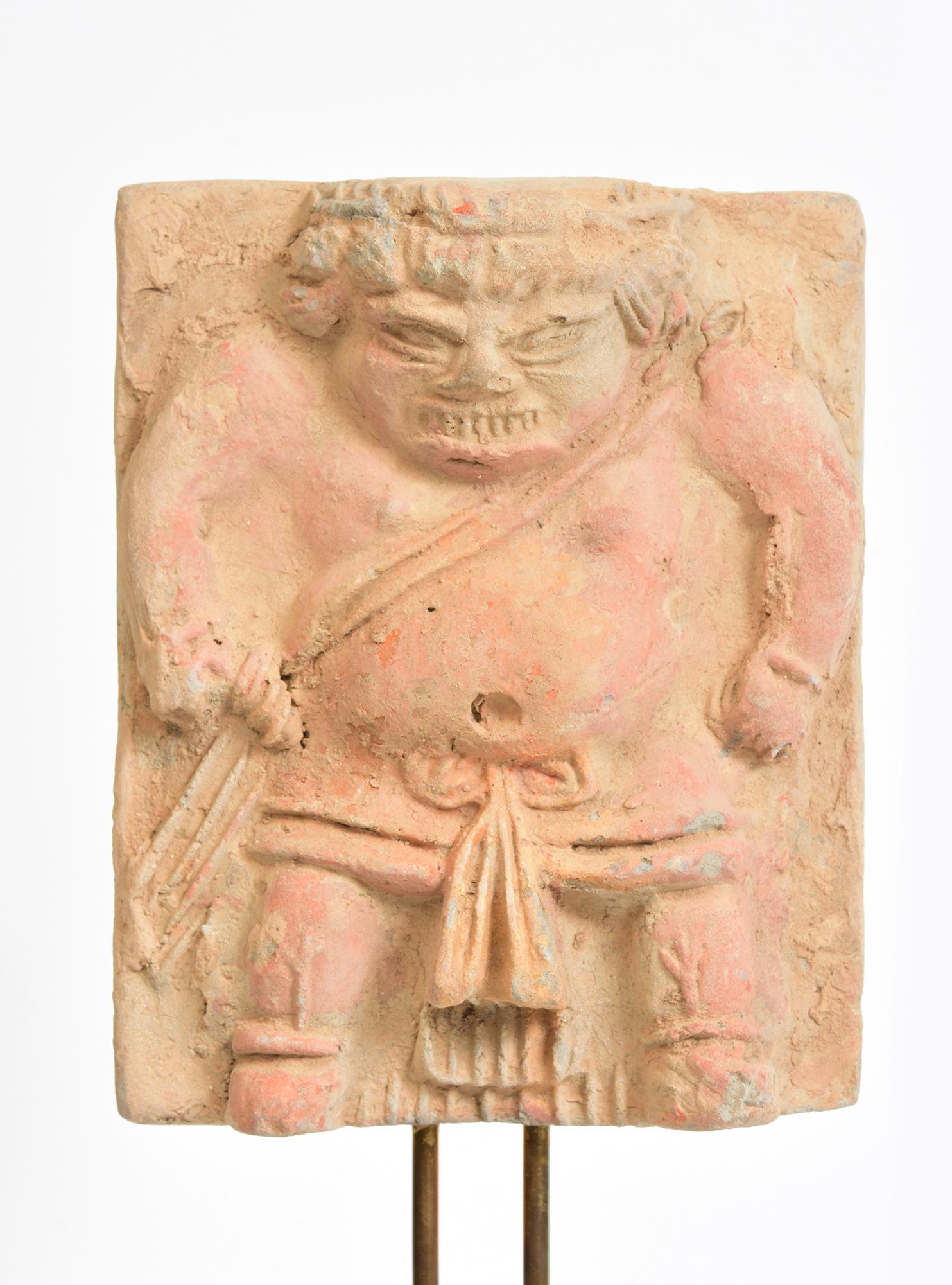 Antique Chinese pottery tomb guardian panel with stand.

Age: China, Song Dynasty, 10th - 12th Century
Size of panel only: Height 15.8 C.M. / Width 12.5 C.M.
Height including stand: 31.5 C.M.
Condition: Well-preserved old burial condition overall