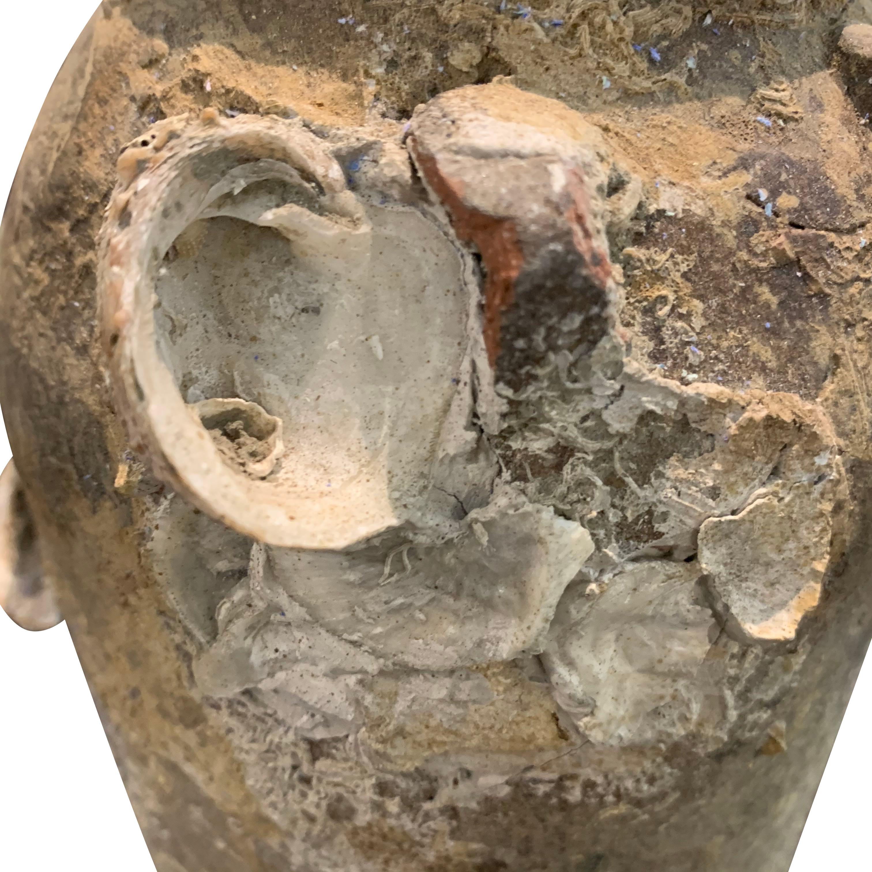 This 15th century China terracotta mussel jar from the Song dynasty is
ship wrecked and covered with barnacles.
The barnacles add interesting texture to the weathered patina.
We have a large collection of 15th and 16th century pots and vases.
  