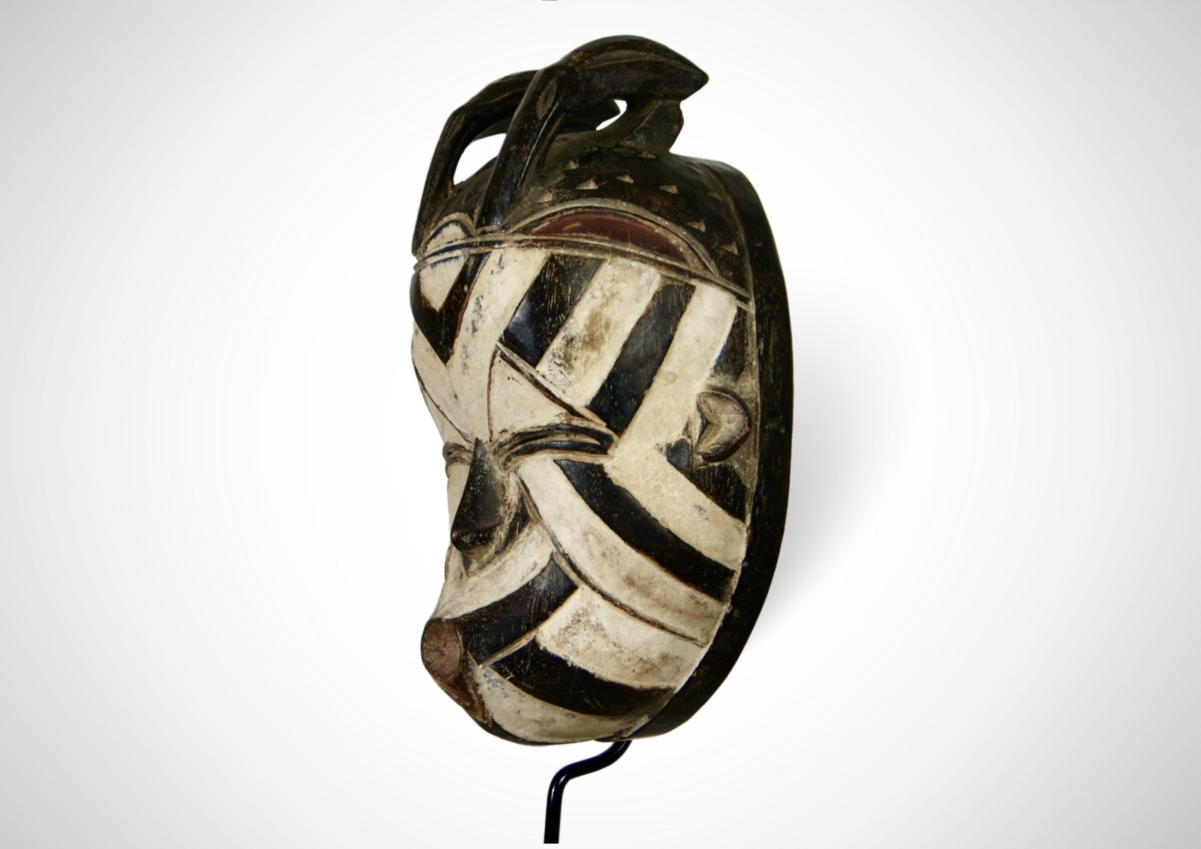 Hand-Carved Songye Basangwe Mask DRC Wall Hanging Mask Circa 1950s For Sale