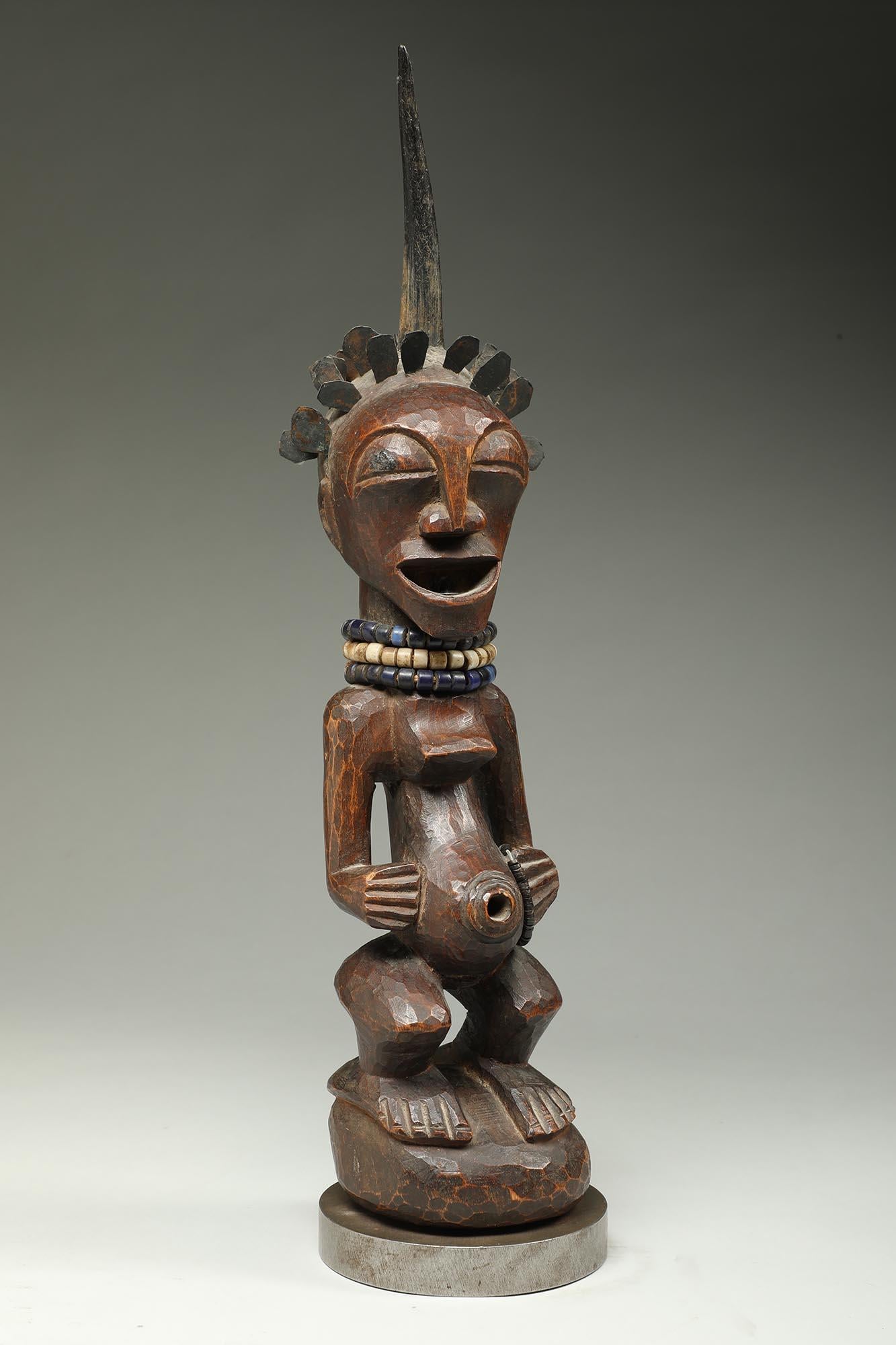 Songye Female Wood Figure with horn and brass hair ex Sothebys   For Sale 1