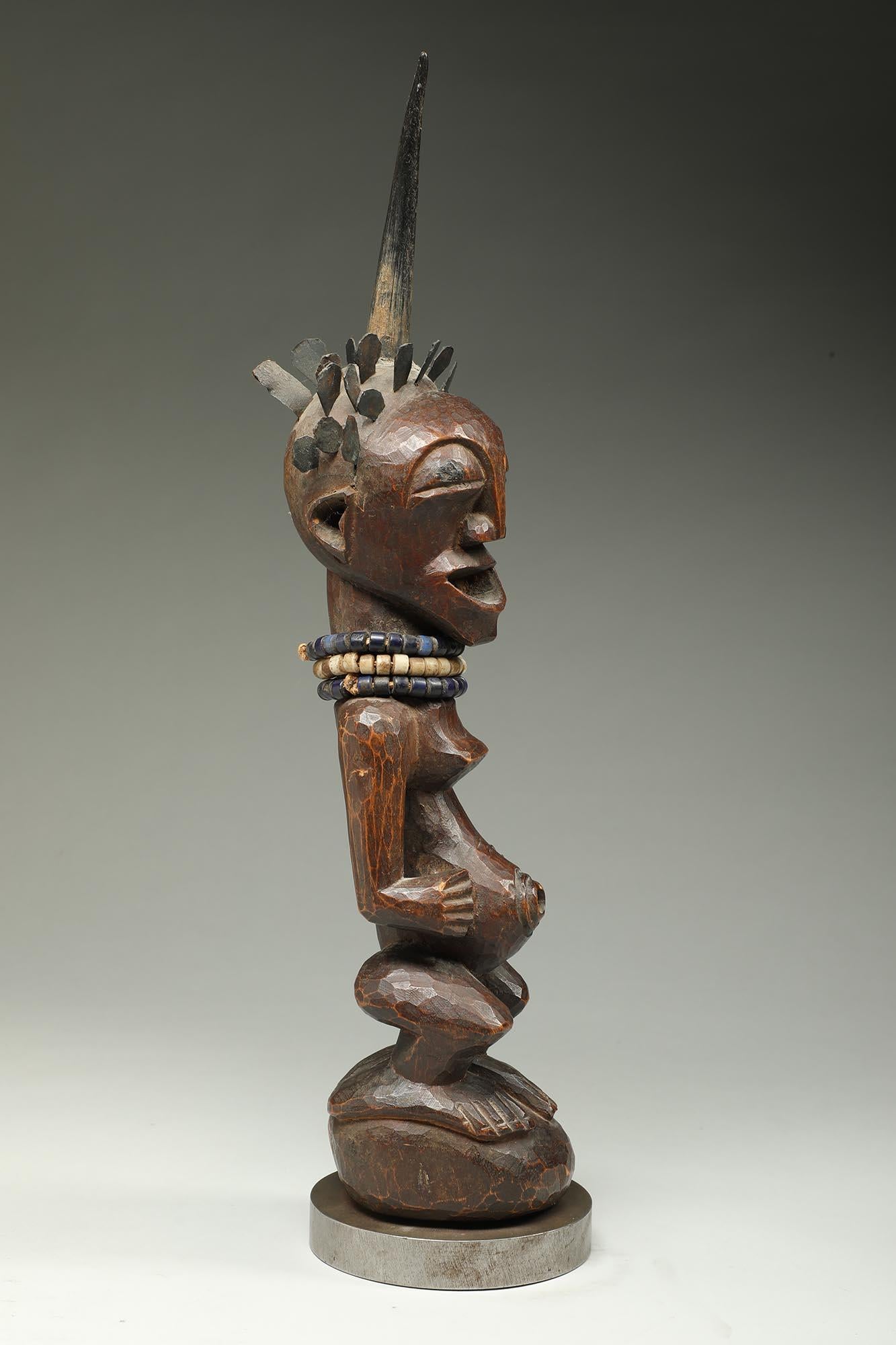 Songye Female Wood Figure with horn and brass hair ex Sothebys   For Sale 2