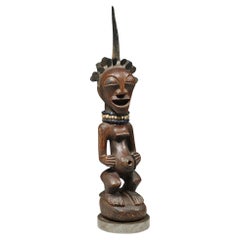 Vintage Songye Female Wood Figure with horn and brass hair ex Sothebys  