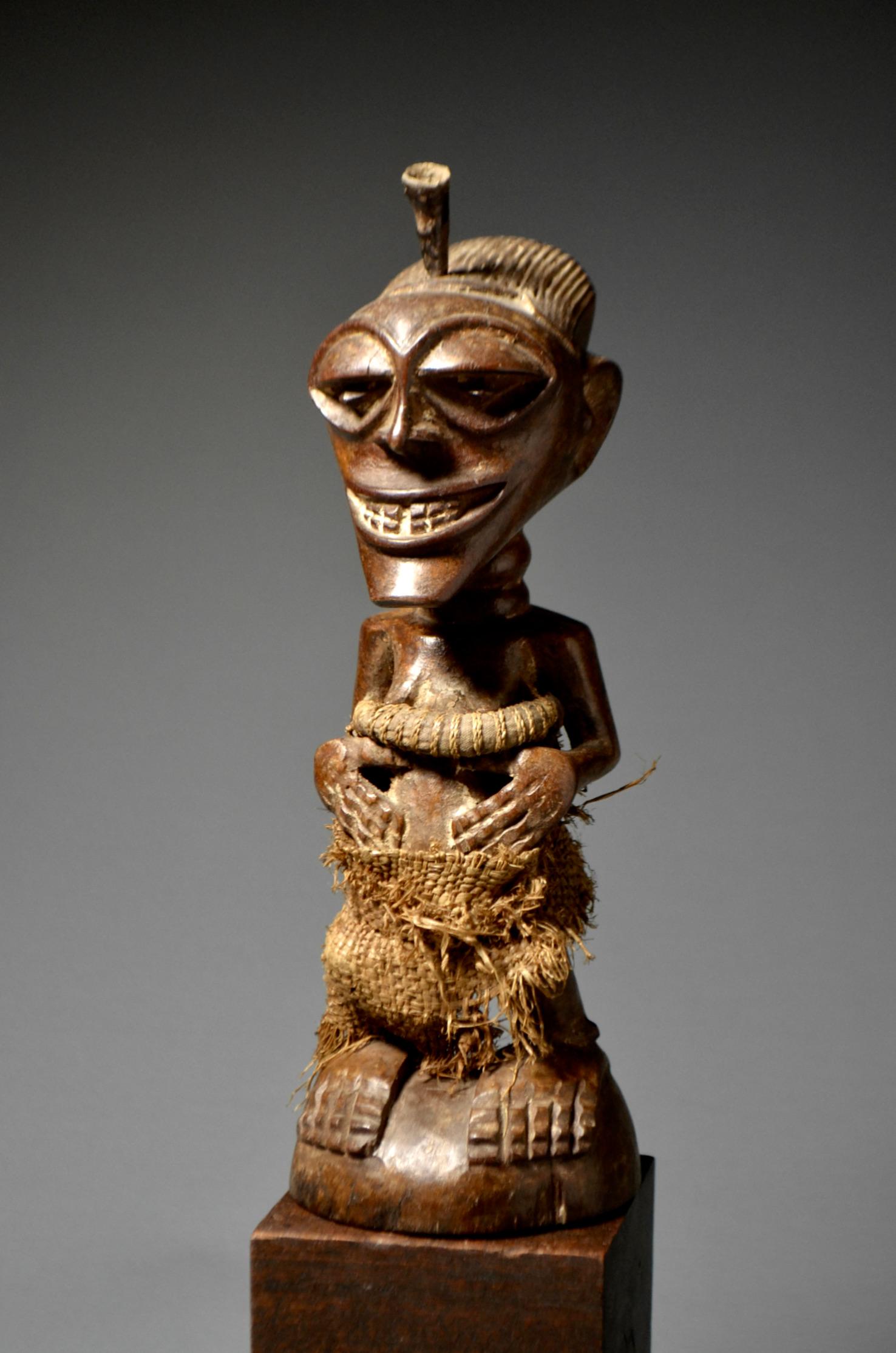 

Songye Power Figure
NKISI

Provenance:
- Private collection, London, United Kingdom


Songye Power Sculpture

Like the Kongo and other related Bantu cultures of central Africa, the Songye people called upon supernatural forces they believed could