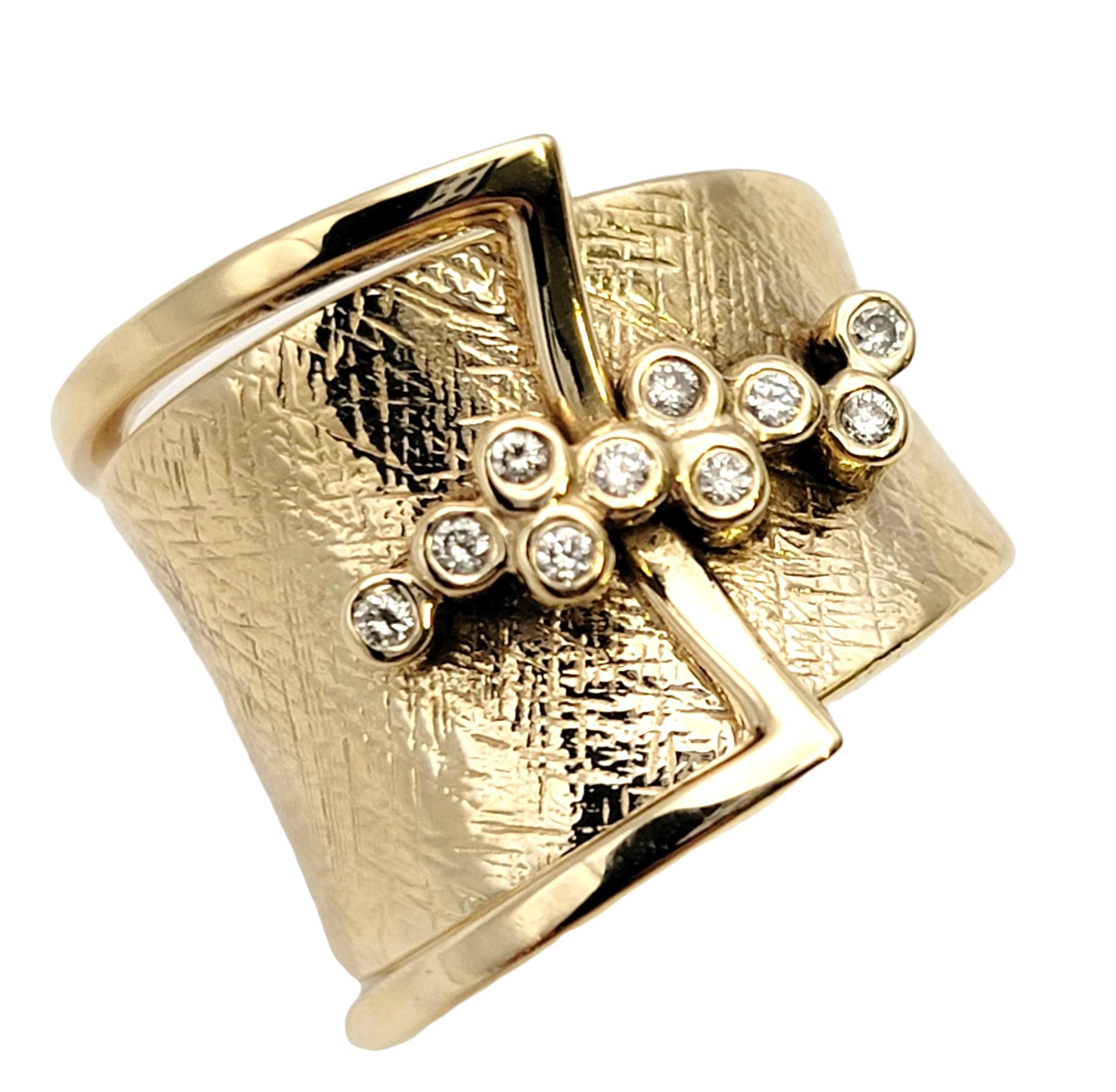 Ring size: 4.75

Chic and elegant, this beautiful Sonia B. ring will wrap your finger in modern beauty. The graduated textured yellow gold band circles the finger and is accented by a small sparkling cluster of round diamonds.
  
Ring size: