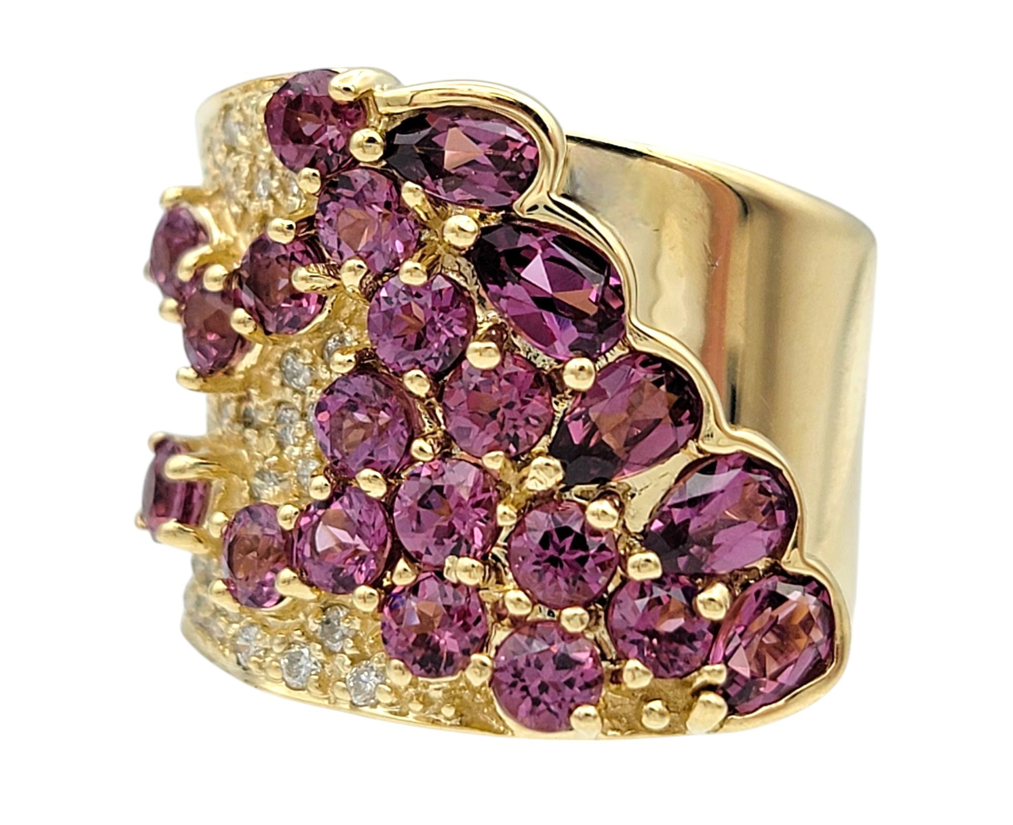 Ring Size: 6

Make a bold statement with this exquisite Sonia B. ring, crafted in 14 karat yellow gold. Featuring a stunning array of dark pink round-cut garnets, this eye-catching design is further enhanced by sparkling round diamonds. The elegant