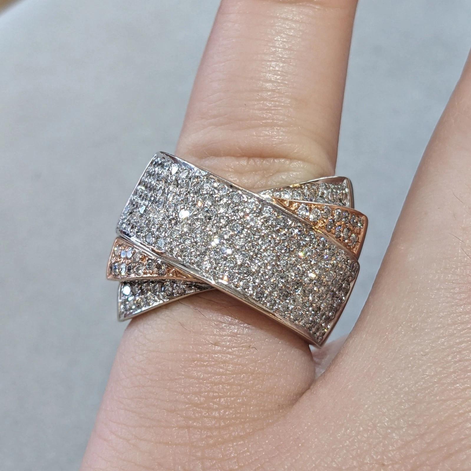 Sonia B Criss-Cross Diamond Wide Band Ring in 14k White & Rose Gold

Wide Diamond Multi Band Ring features Natural Round Diamonds Pave set in 14k White and Rose Gold in a Criss-Cross band by Sonia B.

Total diamond weight is 1.30 carats.

Ring size