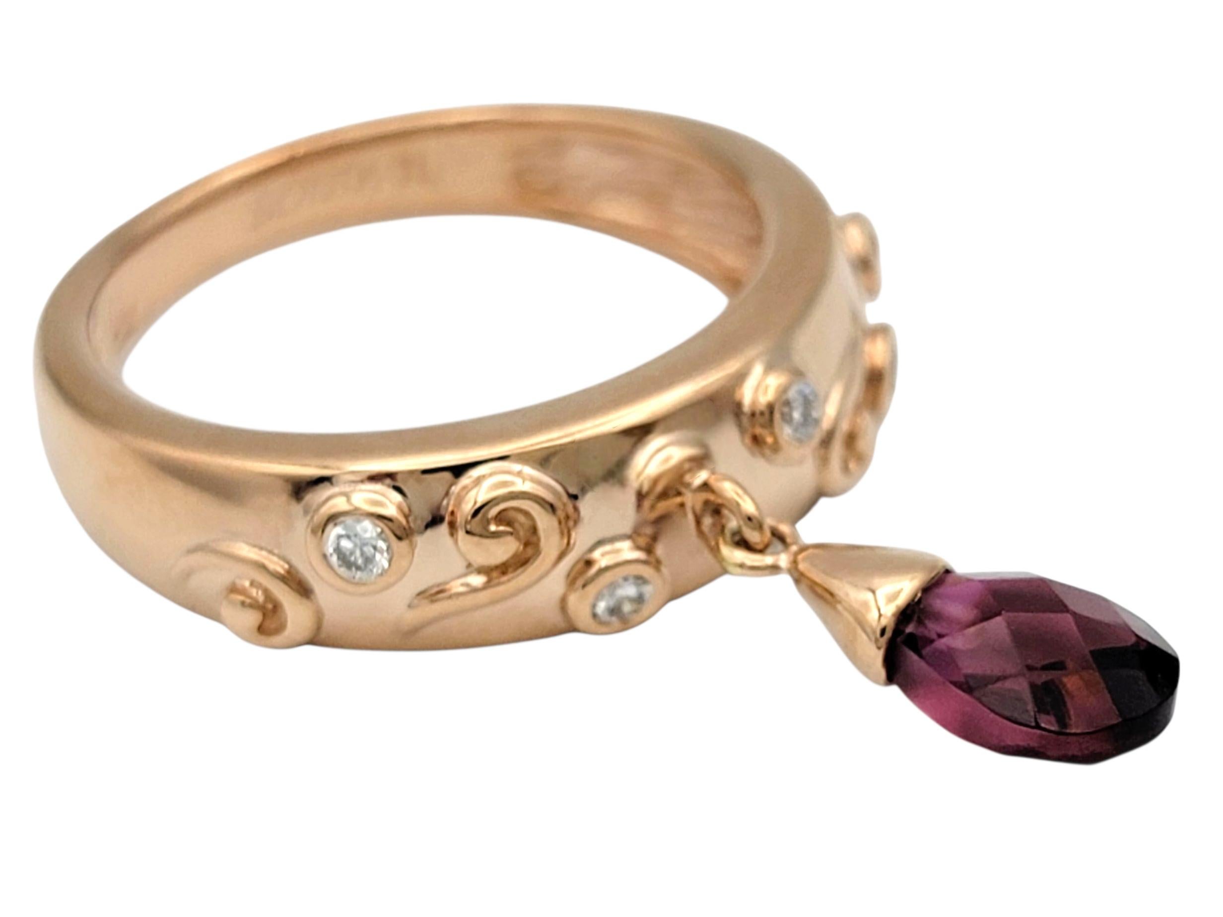 Contemporary Sonia B. Dangling Pear Cut Garnet Scroll Motif Band Ring in 14 Karat Rose Gold For Sale