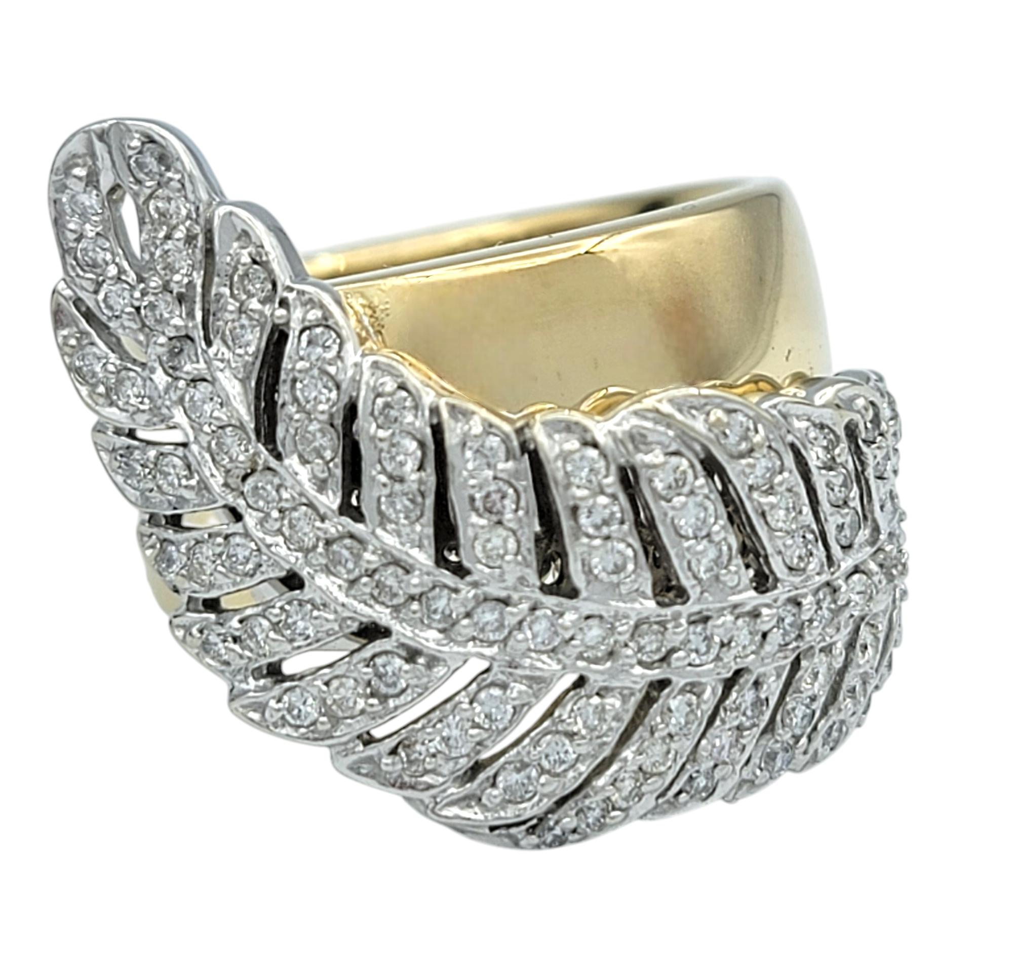 Ring Size: 8

Elevate your collection with this exquisite Sonia B. designer ring, a stunning fusion of artistry and brilliance. Crafted in 14 karat yellow and white gold, this bold statement piece features a graceful feather-inspired design