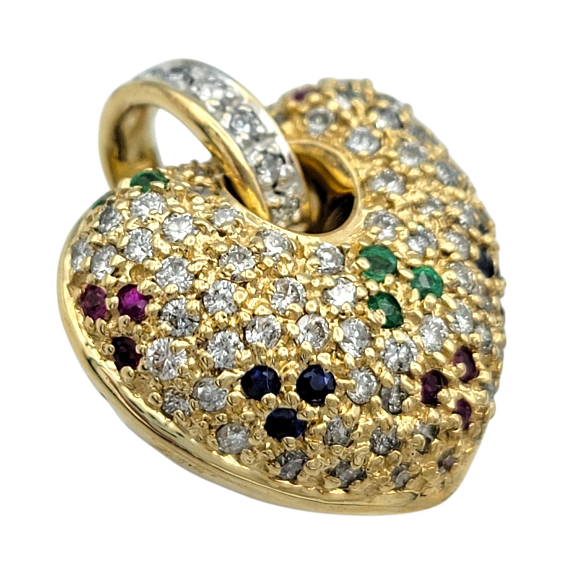 Whimsical and radiant, this puffy heart pendant by Sonia B. bursts with color and brilliance. Crafted in warm 14 karat yellow gold, the heart is pavé set with a glittering array of round brilliant cut diamonds, creating a dazzling surface that