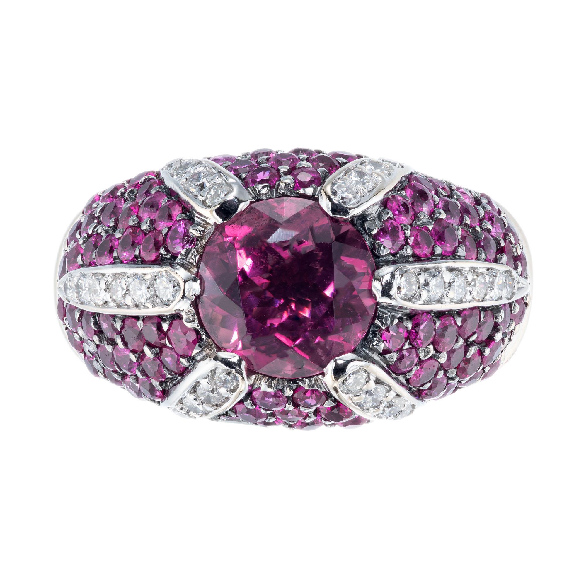 Sonia B round tourmaline, sapphire and diamond cocktail ring. 18k white gold setting with tourmaline center stone, round accent pink sapphires and white diamonds. 

1 pink Tourmaline approx. total weight 1.75ct
28 full cut diamonds approx. total