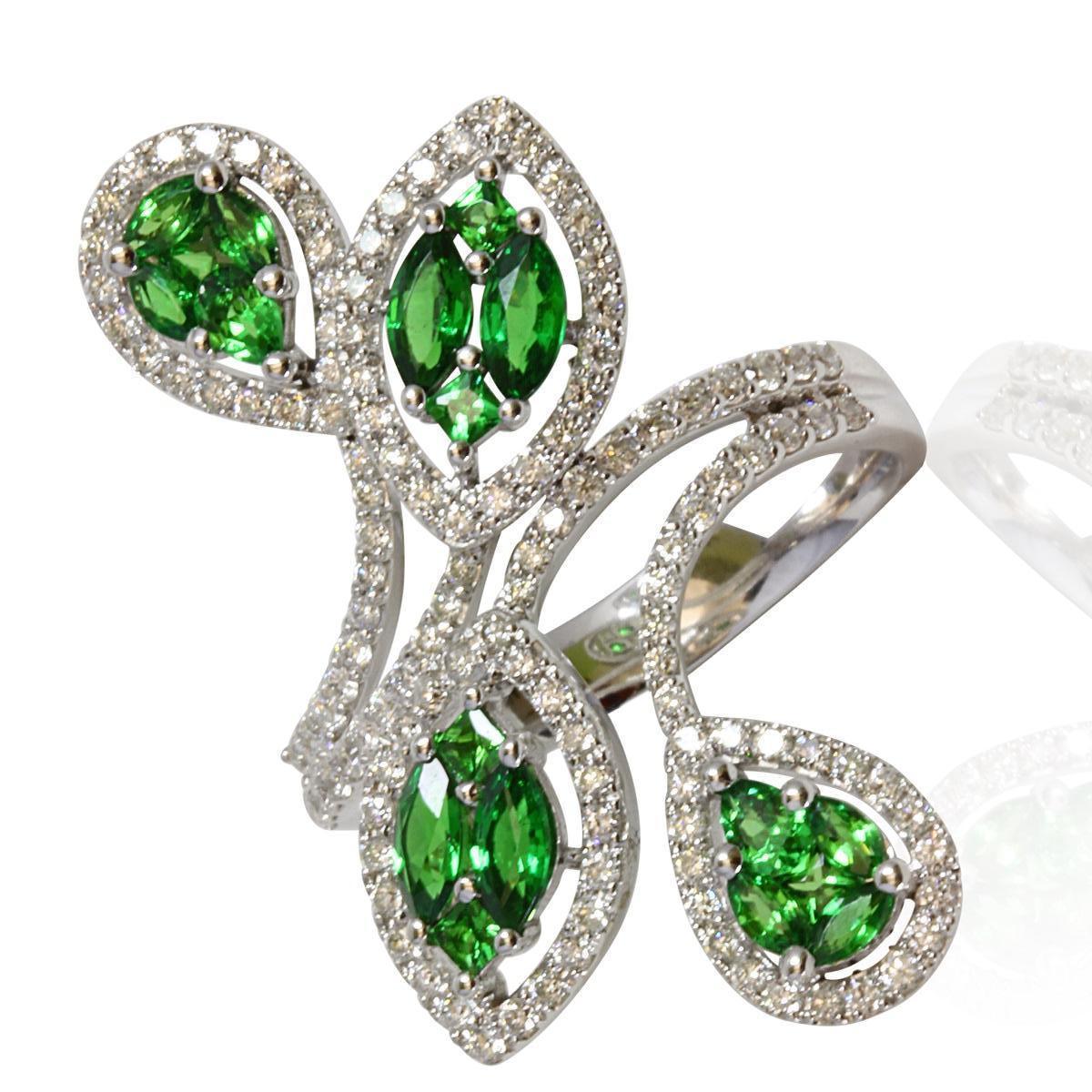 Elevate your style with this mesmerizing tsavorite and diamond ring, the ultimate statement piece that adds the perfect 'Oomph' factor to your look. Crafted in 14K white gold, the ring showcases a distinctive bypass-style design, where the band