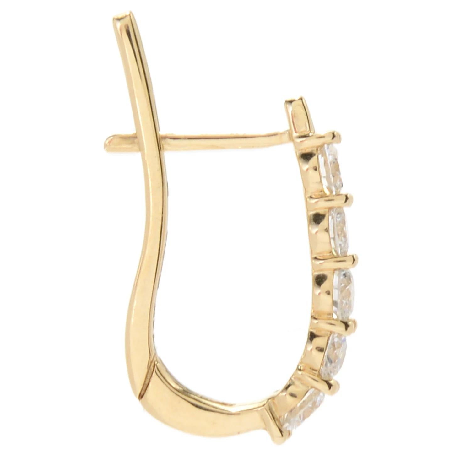 Illuminate your ears with the mesmerizing brilliance of these elegant huggie hoop earrings from Sonia Bitton. Created from 14K gold, available in your preferred color, each earring showcases a captivating column of white diamonds along the front.