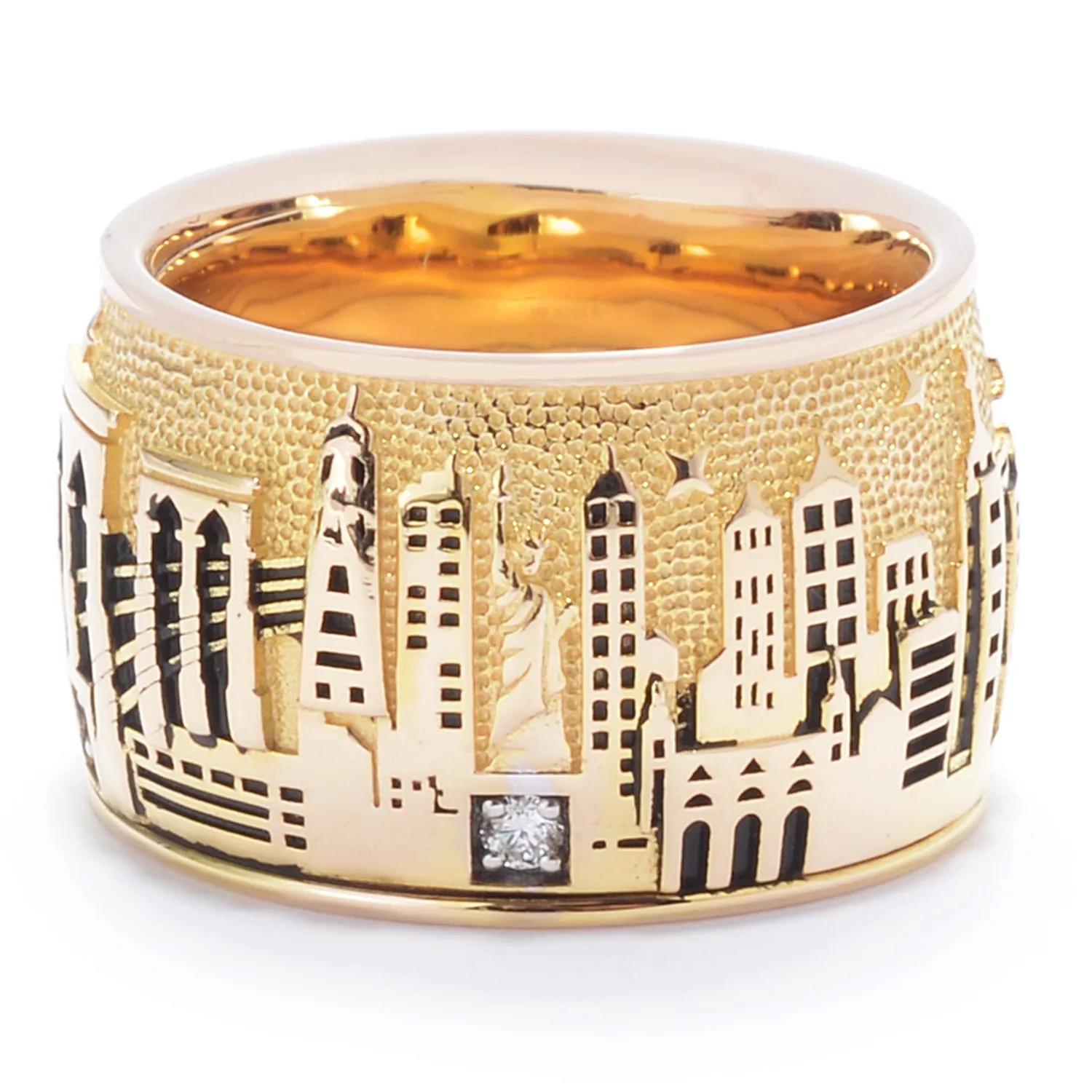 Carry the iconic New York City skyline with you wherever you wander! Crafted in 14K gold, this ring boasts an elaborately embossed design of the Big Apple's majestic skyscrapers. Three sparkling diamonds are gracefully scattered along the bottom
