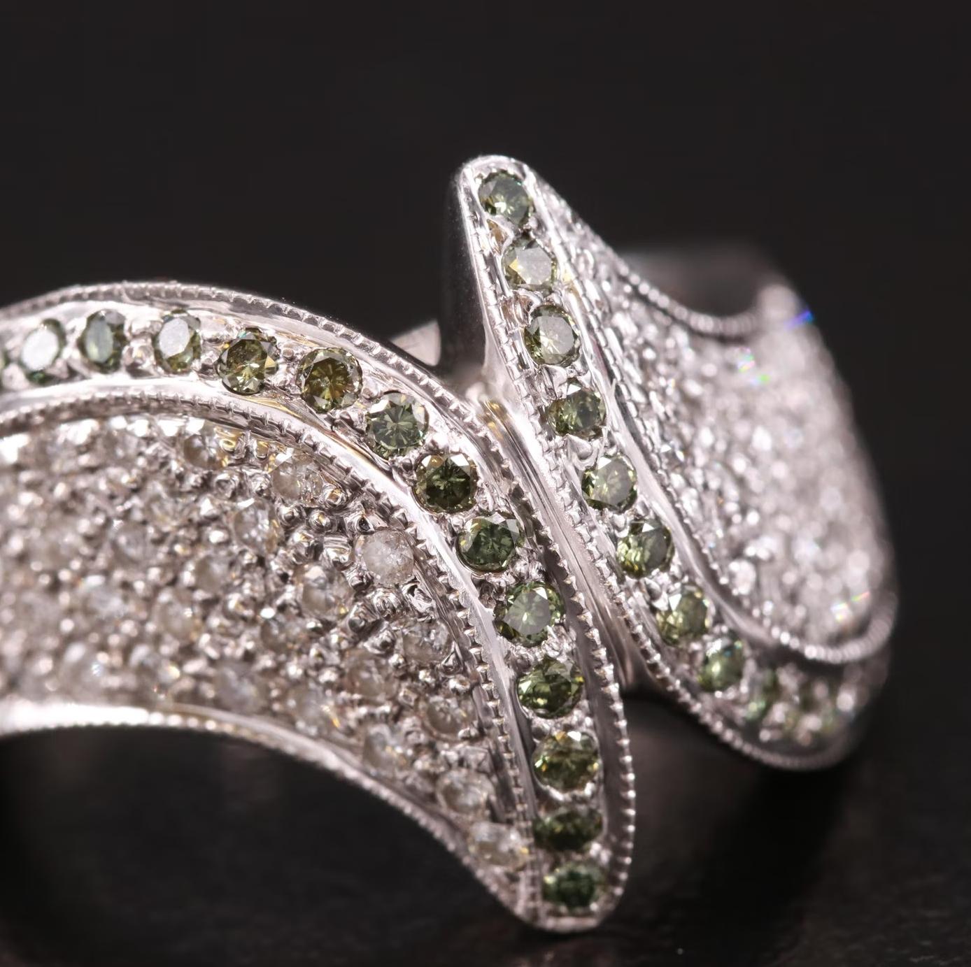 Sonia B ring, stamped and hallmarked SNB

NEW WITH TAGS, Tag Price $4950

Amazing Bypass design

Heavy and well made, 7.8 grams

1.35 CWT Diamond, G-Fancy Green / SI Clarity / TOP QUALITY 

14K solid White gold, stamped 14K

Head turner, statement