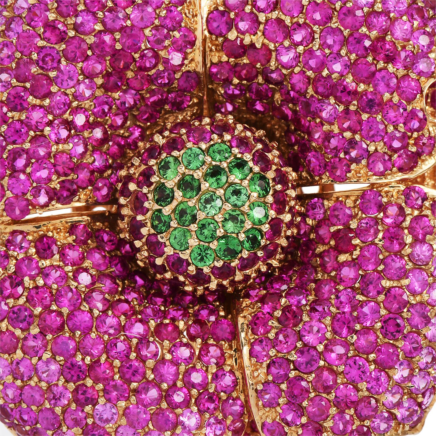 Presenting a Designer statement Brooch Pin by Sonia Bitton hand-crafted in 14K yellow gold with genuine pink sapphires and Tsavorite gemstones.

The three-layer flower motif brooch is decorated with precious natural round Pave Pink Sapphires and