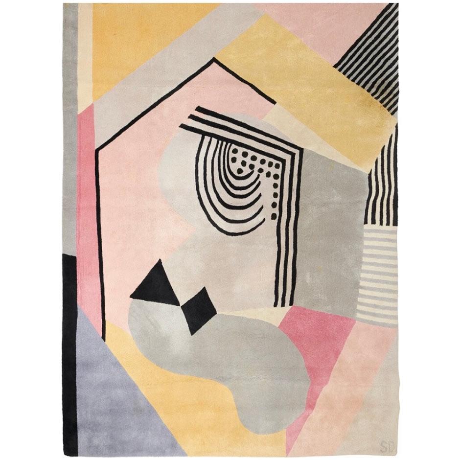 Disegnato dalla pionieristica artista Sonia Delaunay, questo tappeto in lana francese riflette l'audace astrazione geometrica che ha definito l'avanguardia del primo Novecento. Delaunay è stata una figura centrale del movimento dell'Orfismo e un