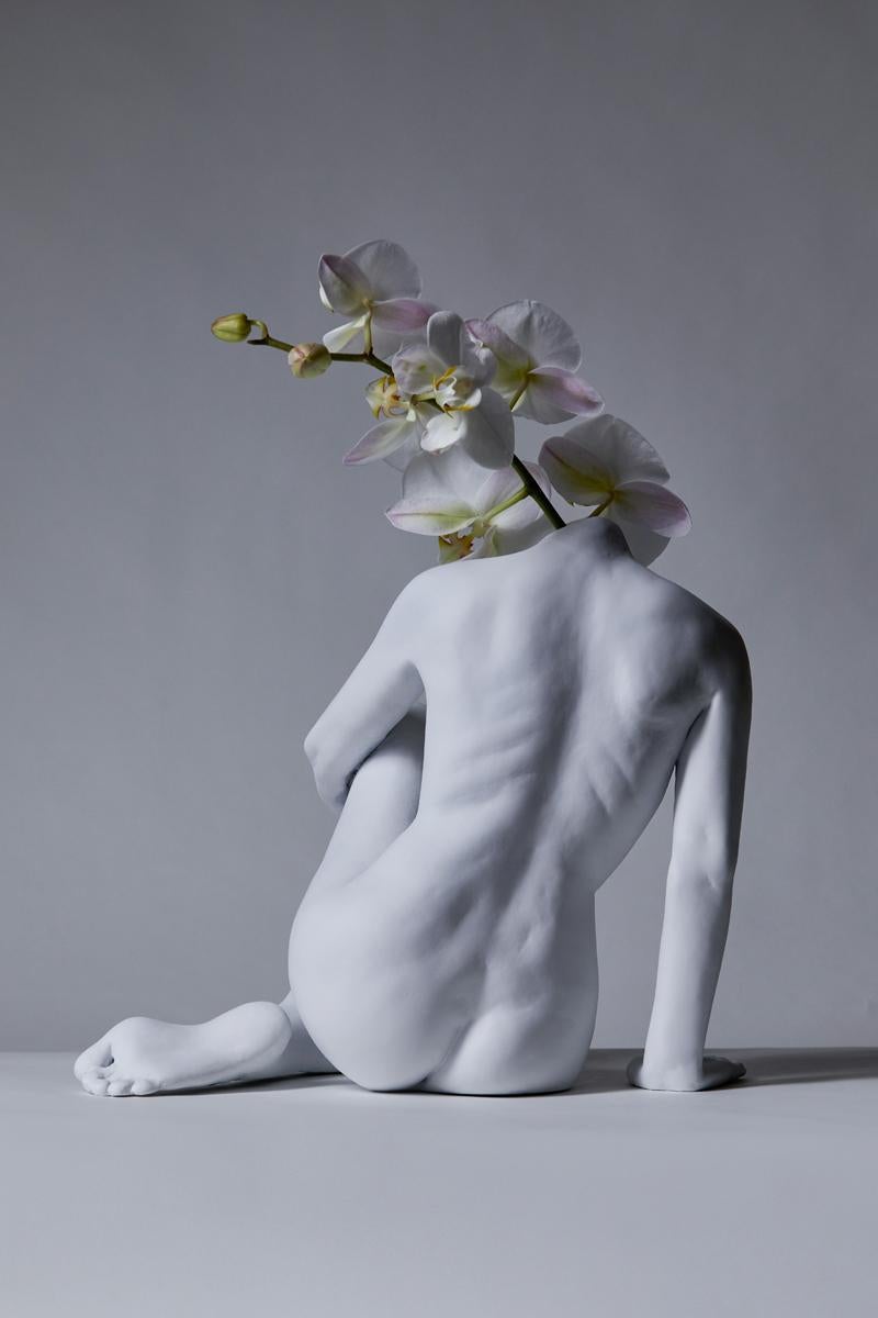 This sculpture by Sonia Pacheco is stunning from all angles. This piece can double as a vase for fresh flowers.

Using a live, nude model in studio as a reference, this form was originally sculpted from clay and then cast as resin.

The piece comes