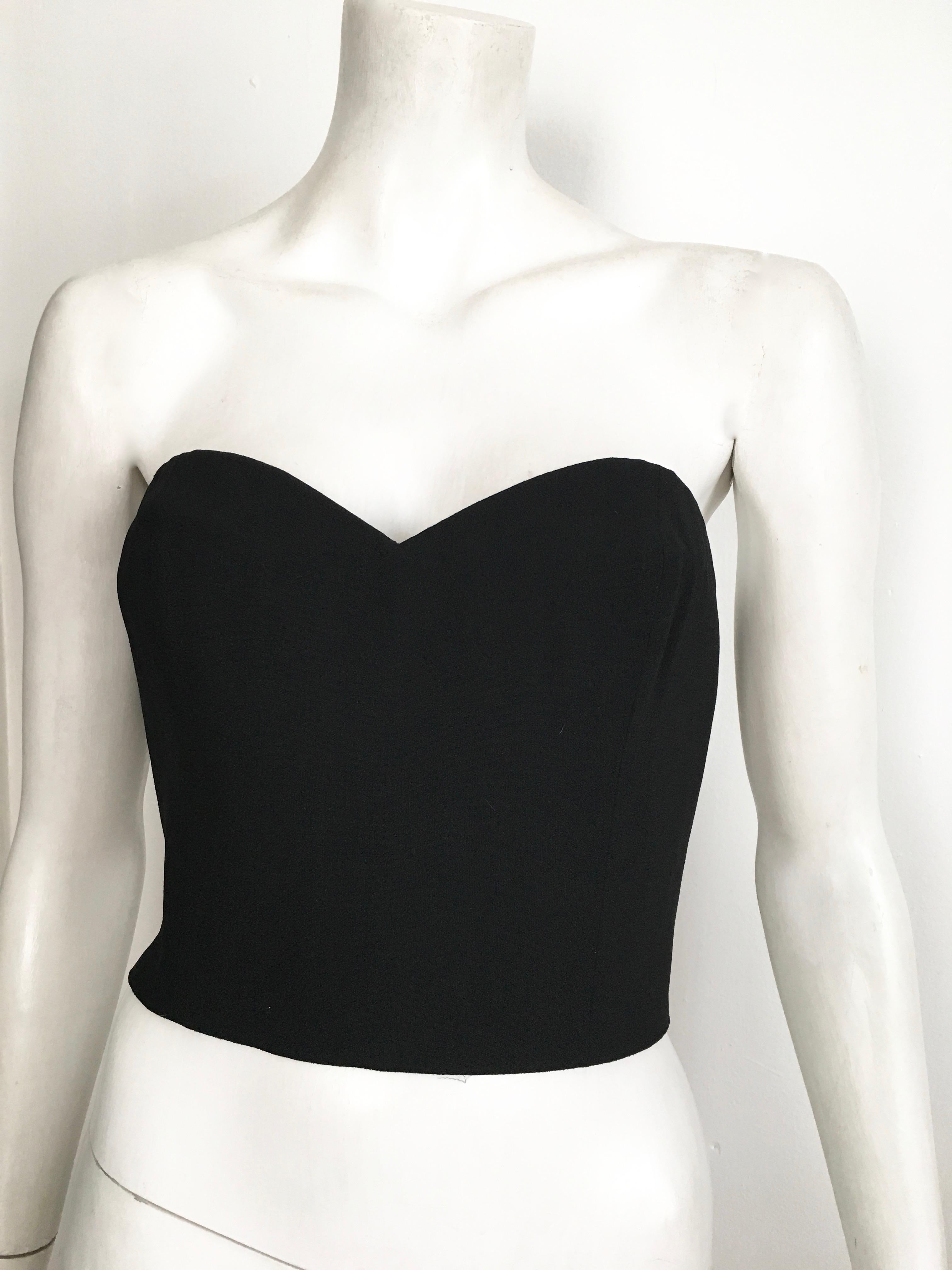 Sonia Rykiel 1980s black bustier is labeled a French size 42 and fits like an USA size 8.  
The waist on this bustier is 28. 1/2