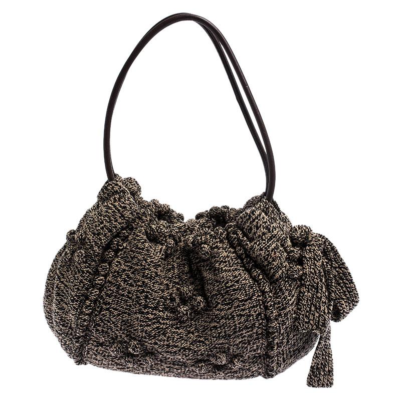 Coming from the house of Sonia Rykiel, this hobo is a dream come true for every fashionista. This hobo is crafted from tweed and you can stow all your belongings inside the fabric-lined interior. It can be carried using the dual handles.

