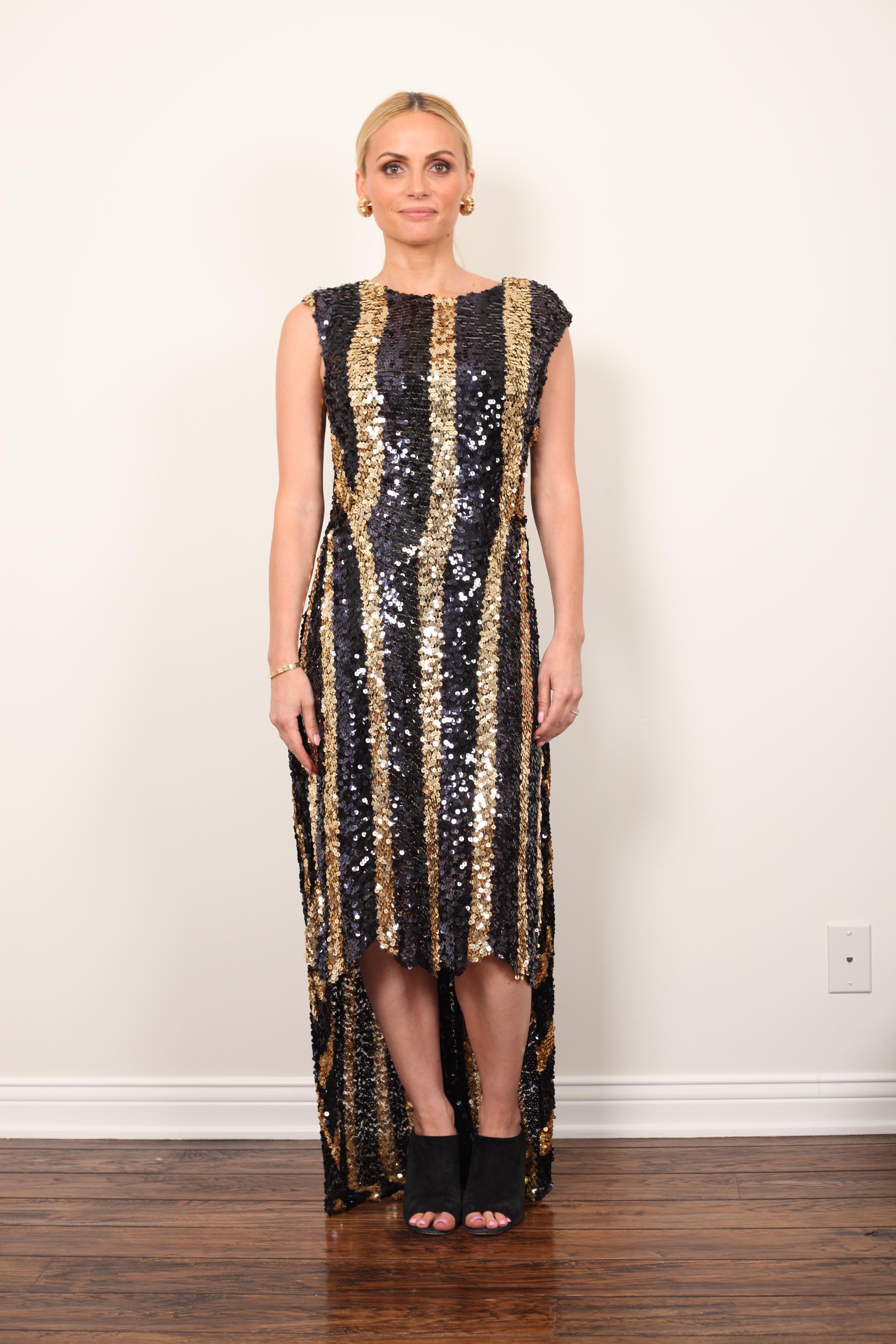 Super funky black and gold vertical stripe sequin dress by Sonia Rykiel. This dress is sleeveless with a high-low hemline. 
The back hem is floor length with a slight train while the front hits above the knee. 
Very comfortable ! 
Size US 10 (fits