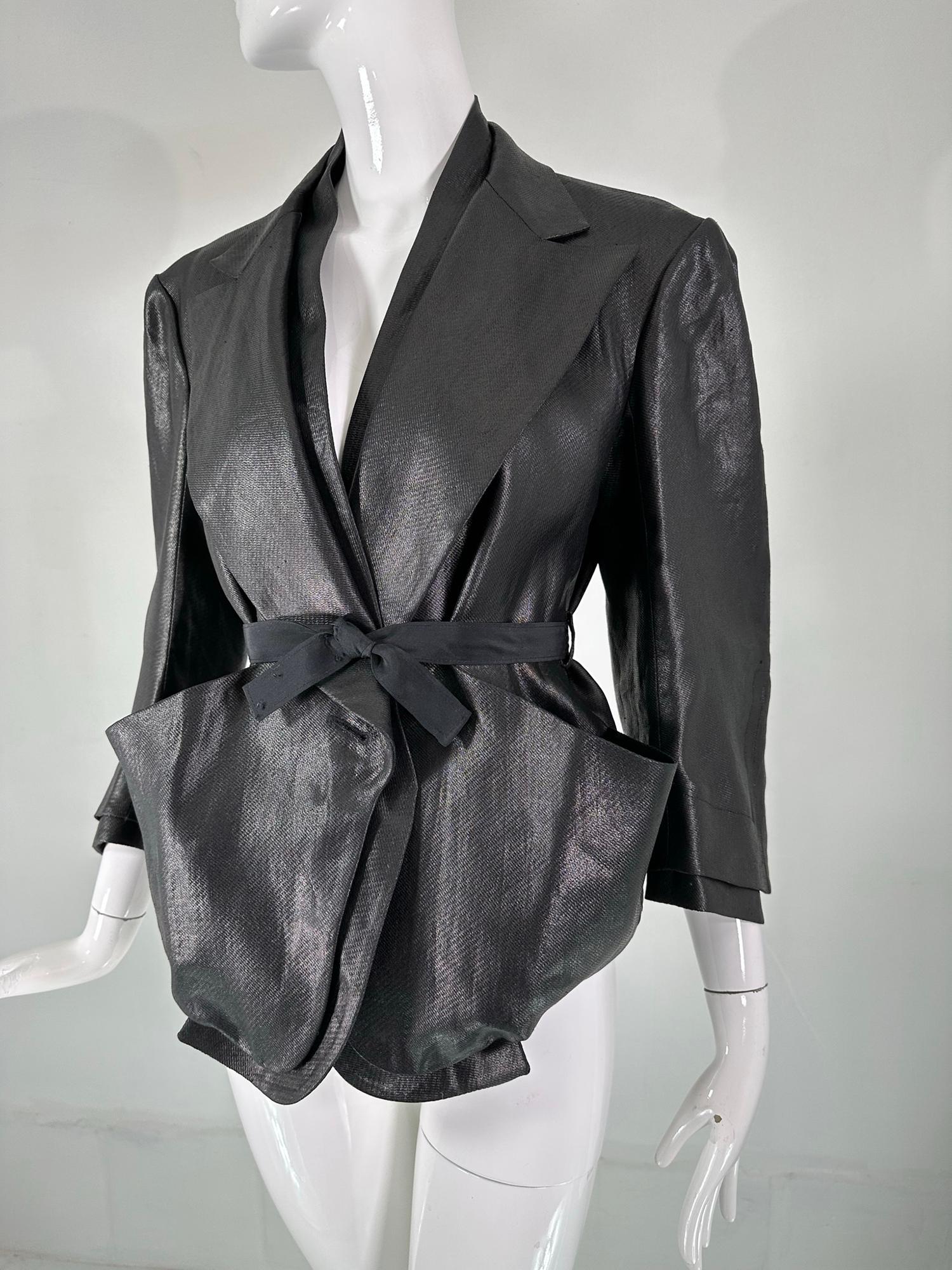 Sonia Rykiel black glazed linen, big pocket, button facings, belted cropped jacket. This is a special jacket with lots of style. The fabric has the look of leather, but upon close inspection you can see the beauty of the process of the fabric. The