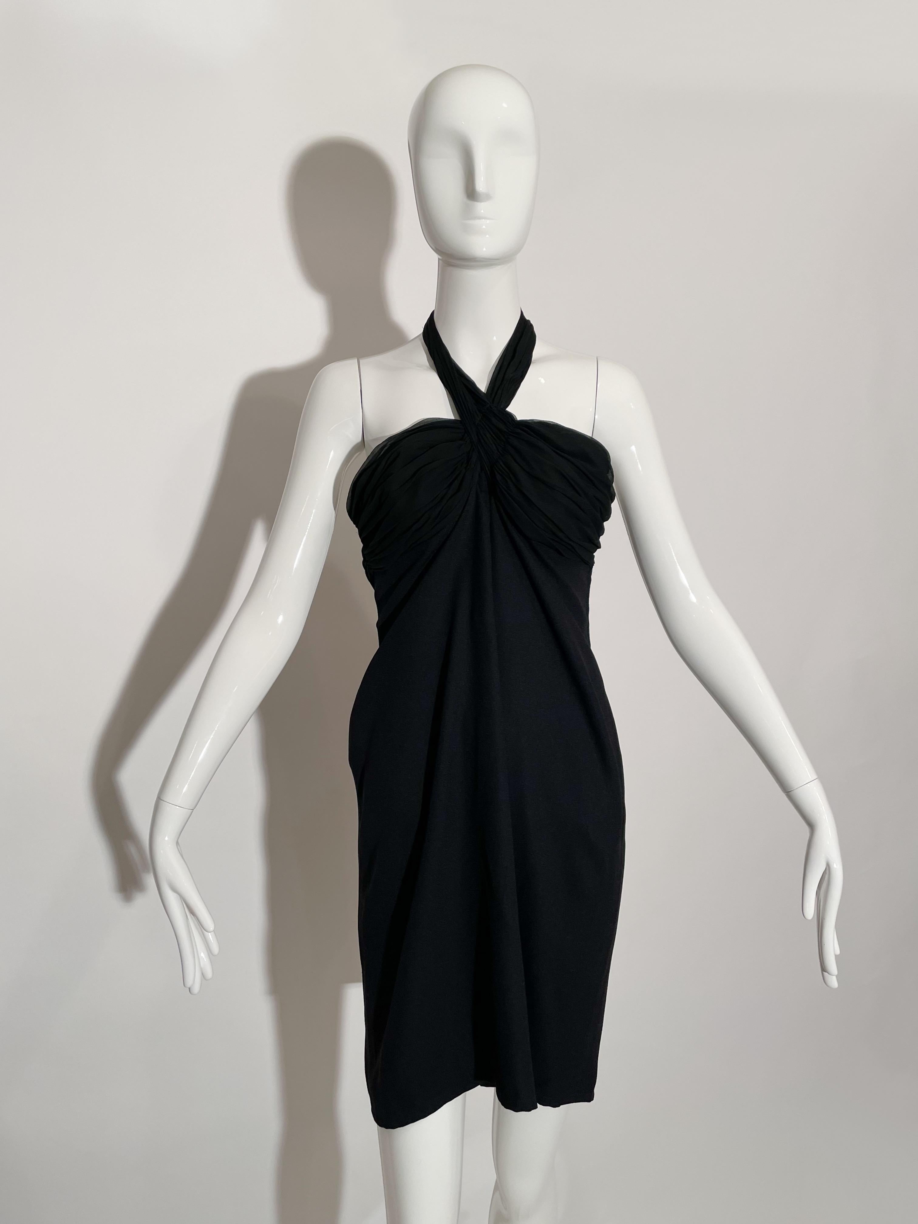 Black halter dress. Ruching detail at chest. Side bust zipper closure.  Acetate and Rayon. Lined. Made in France. 

*Condition: excellent vintage condition, no visible flaws.


Measurements Taken Laying Flat (inches)—

Bust: 32 in.

Waist: 29