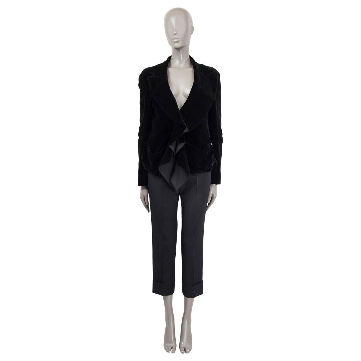 100% authentic Sonia Rykiel ruched blazer in black velvet (please note content tag missing). Features buttoned cuffs, two pockets on the front and a sewn shut chest pockets. Opens with with a ribbon on the front. Lined in black silk (100%). Has been