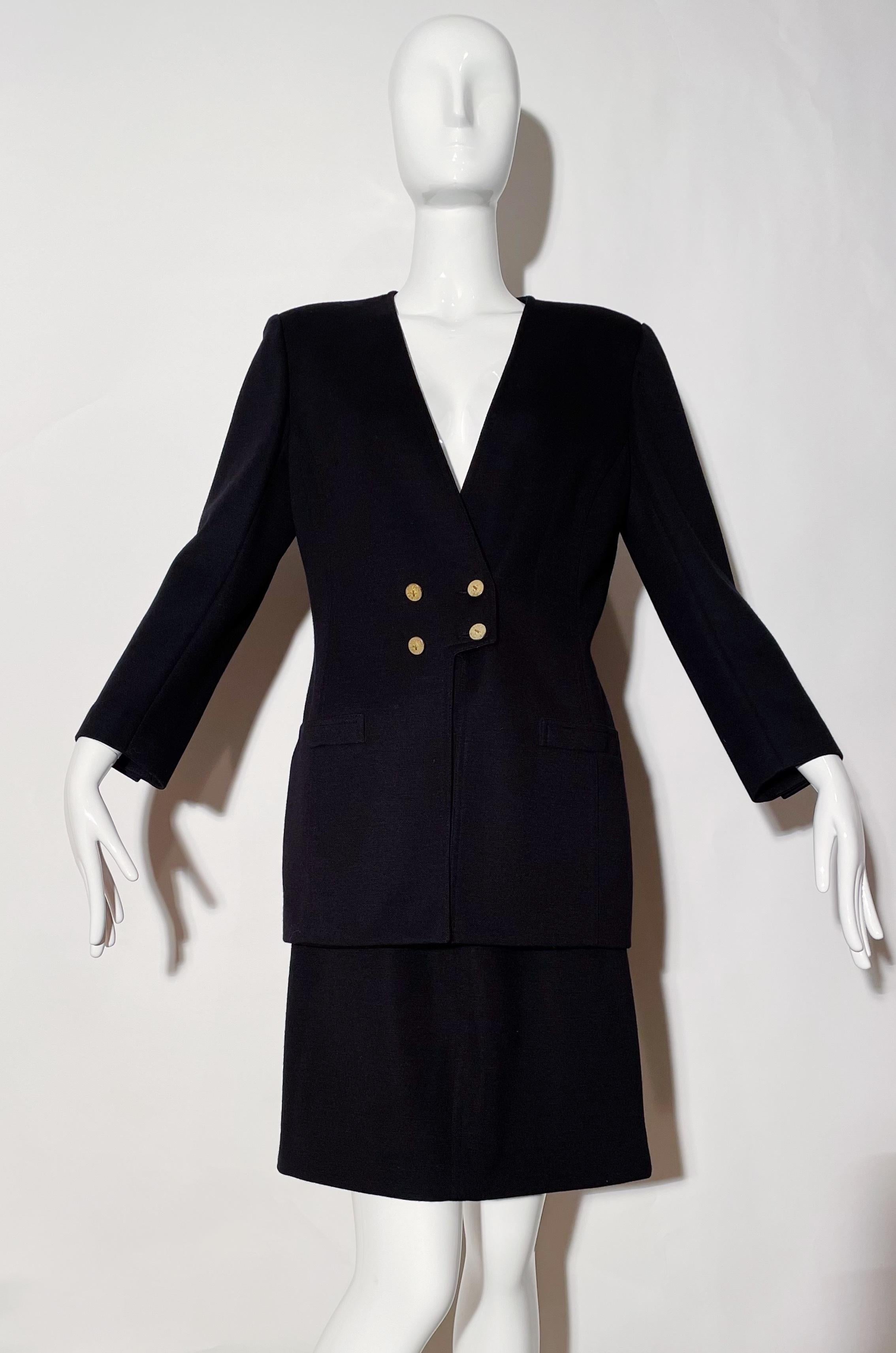 Black skirt suit. Shoulder pads. Front button closure. Front pockets. Rear zipper closure on skirt. Lined. Wool. 
*Condition: Excellent vintage condition. No visible flaws.

Measurements Taken Laying Flat (inches)—
Shoulder to Shoulder: 17