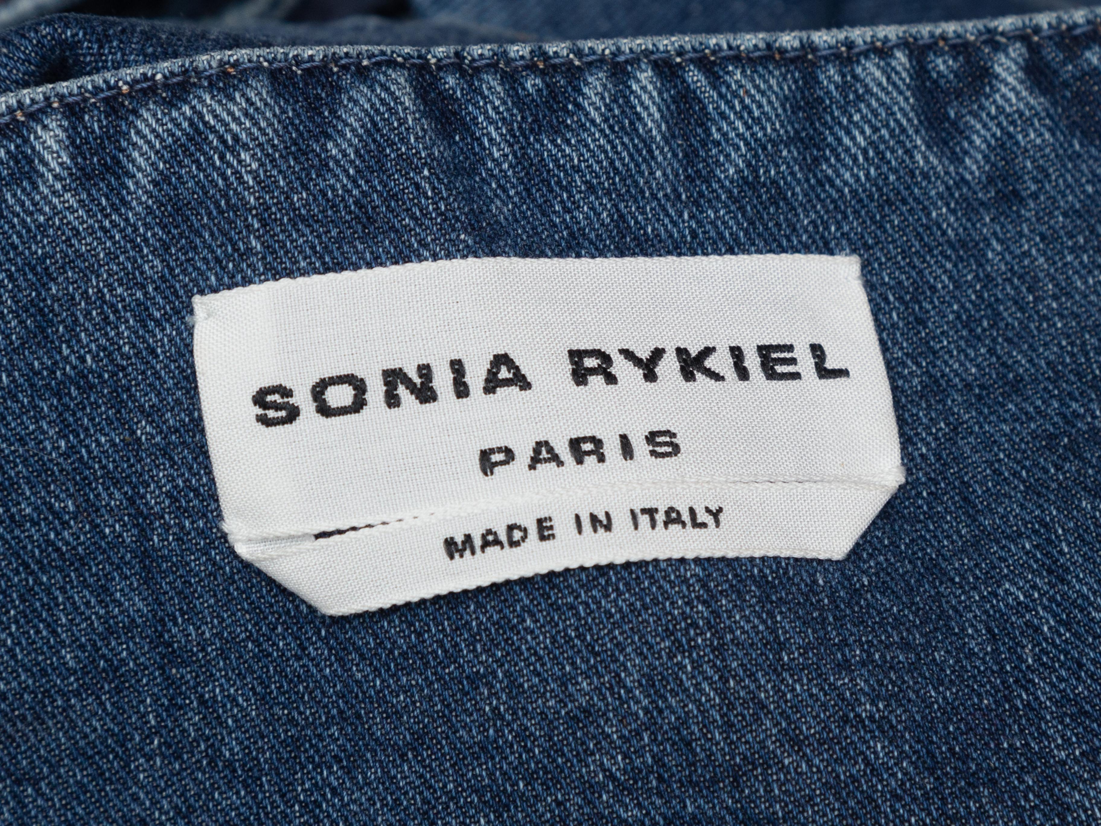 Product details: Blue denim open back overalls by Sonia Rykiel. Square neckline. Button closures at hips and zip closures at sides. Designer size 36. 32