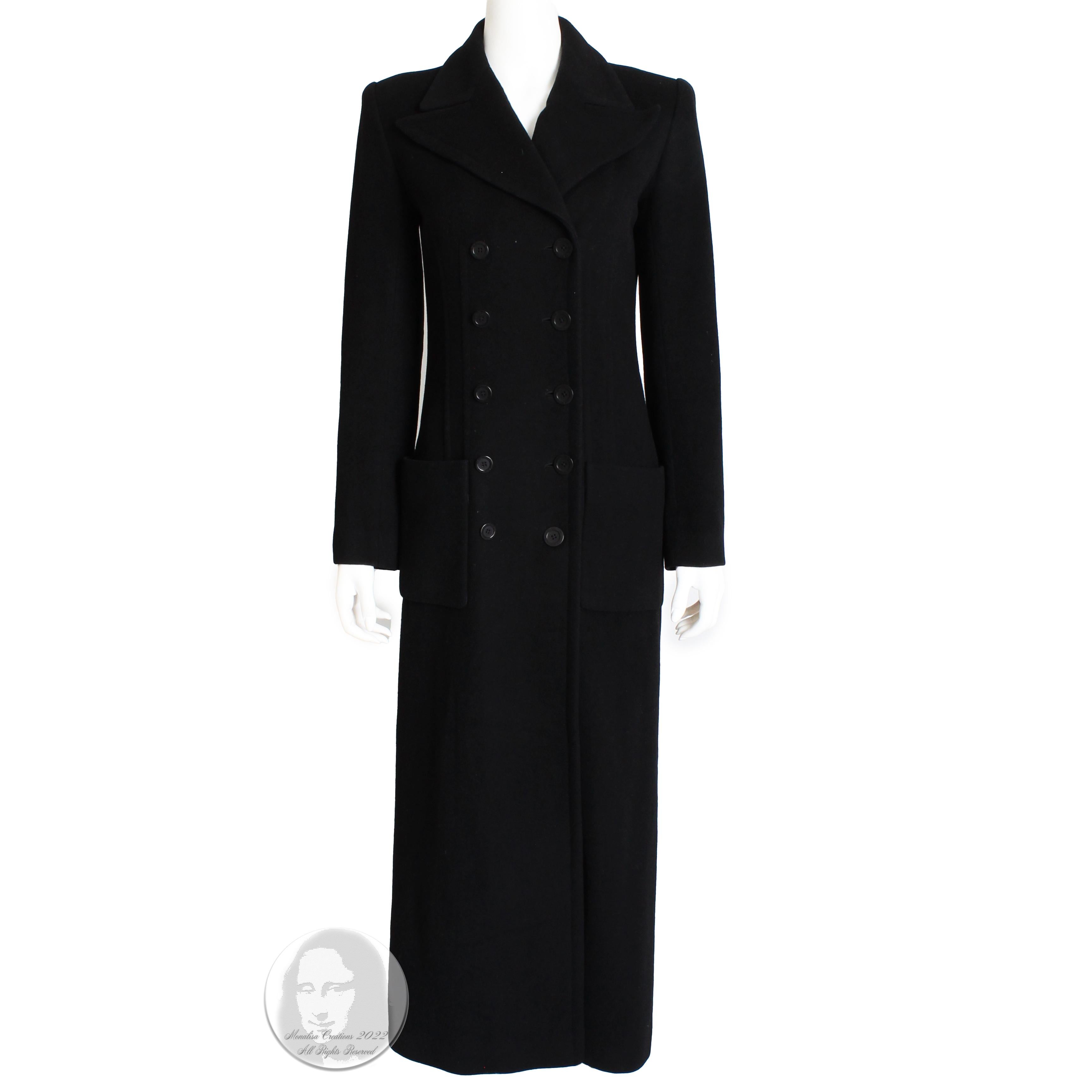 This classic long coat was made by Sonia Rykiel, most likely in the late 1990s.  Made from black supple cashmere, it features double-breasted construction and is fully-lined in gray pin-striped fabric.  

A timeless classic, the cashmere is