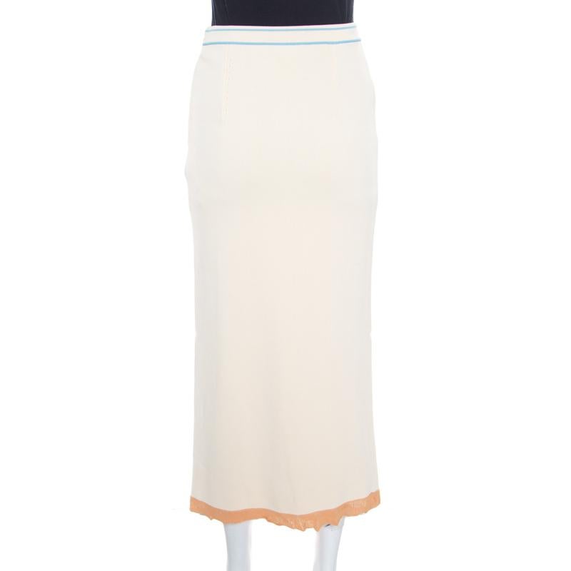 Sonia Rykiel's midi skirt is crafted in a straight, fitted structure making it a stylish piece to flaunt for a chic look. It features a solid cream hue and a contrasting-colored trim at the hem. A versatile piece, you can wear it for both your