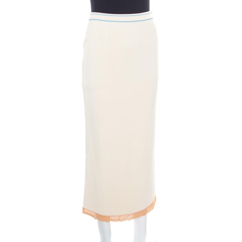 La falda midi de Sonia Rykiel está confeccionada con una estructura recta y entallada que la convierte en una pieza elegante de la que presumir para un look chic. Presenta un tono crema liso y un ribete de color en contraste en el dobladillo. Una