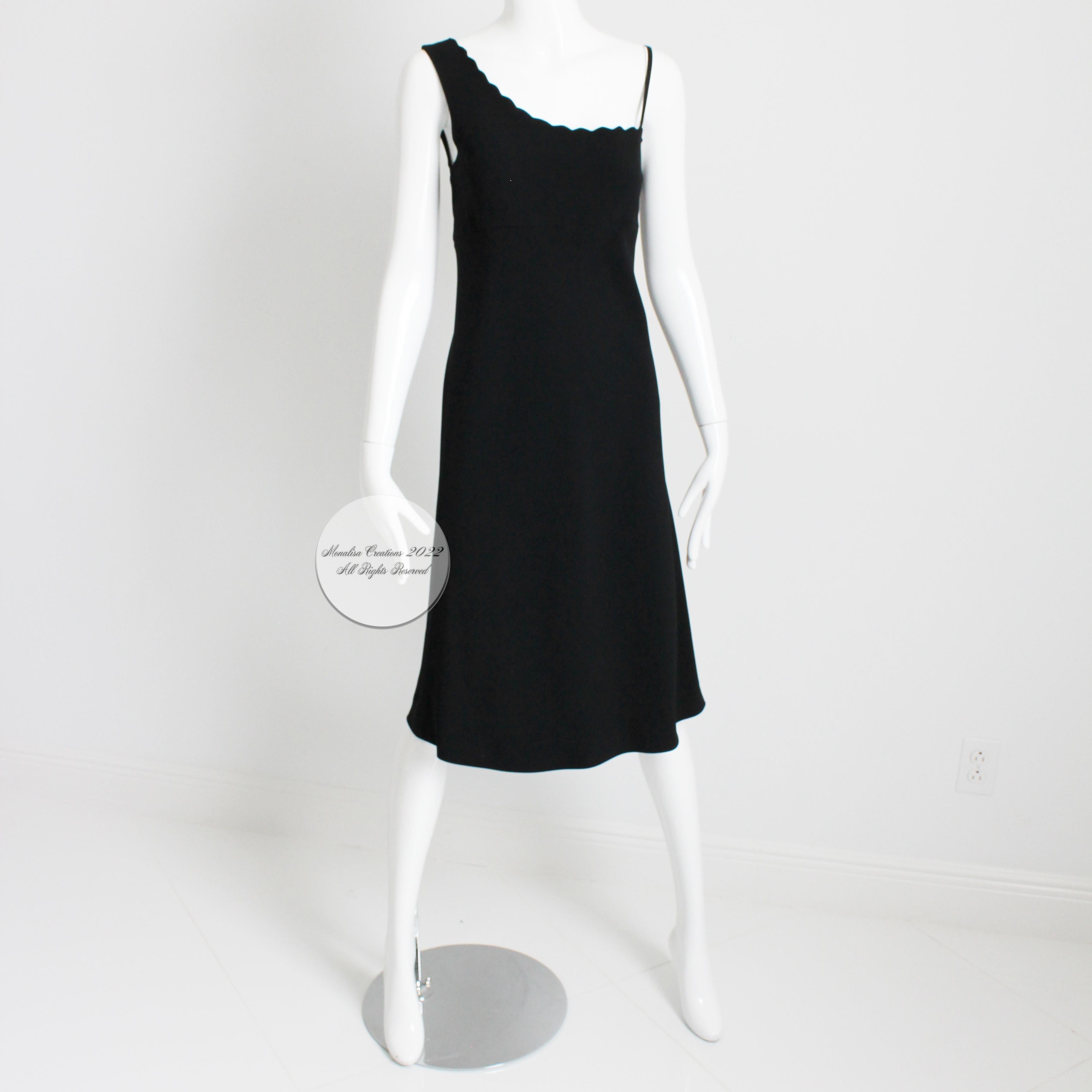 Preowned vintage Sonia Rykiel Paris little black dress, circa the 90s.  Made from a black crepe fabric (no content label, feels like a rayon blend), it fastens with a side zip, with one shoulder construction and a scalloped edge along the collar. 